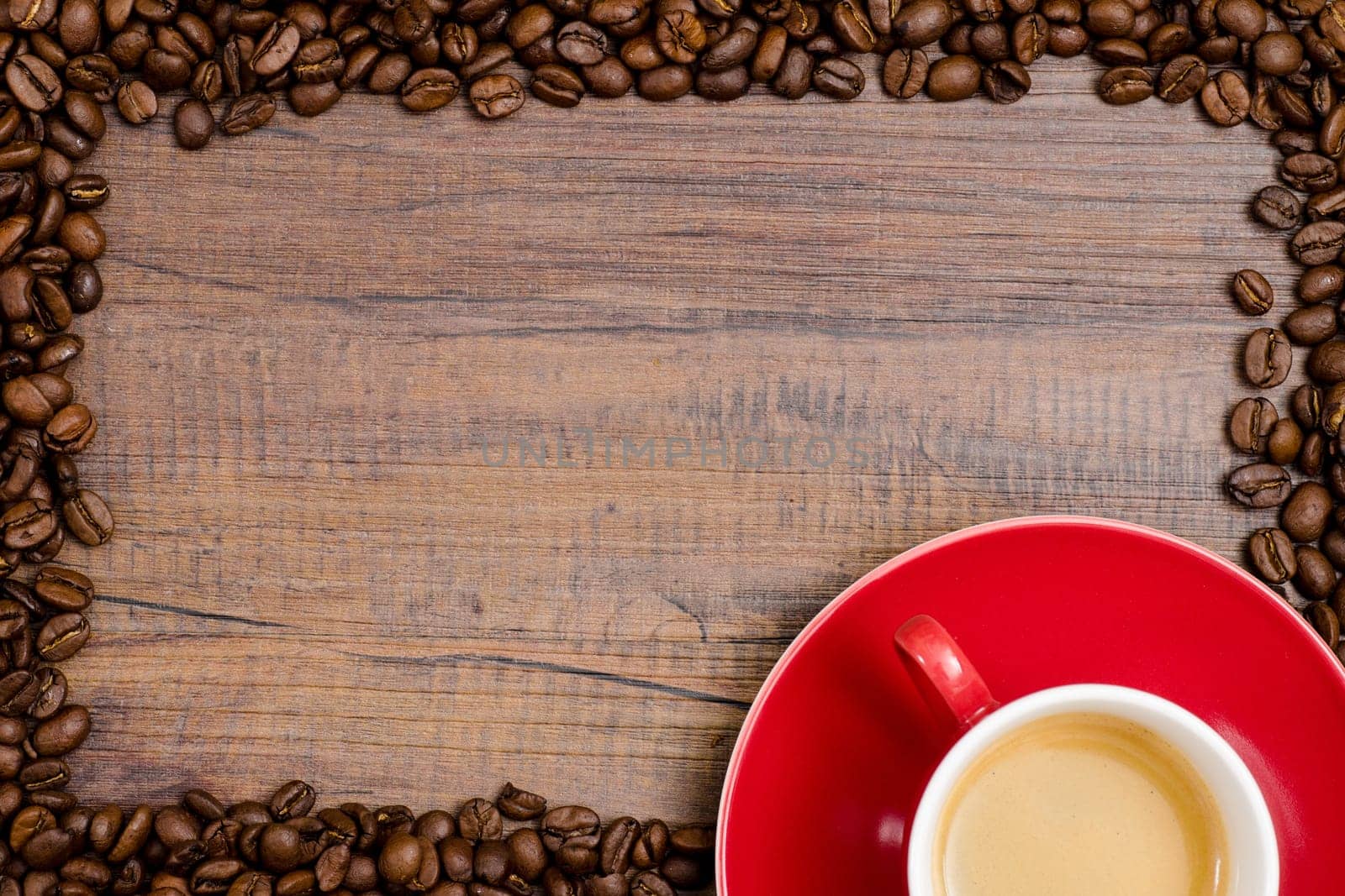 Cup espresso with beans on brown wood with text space