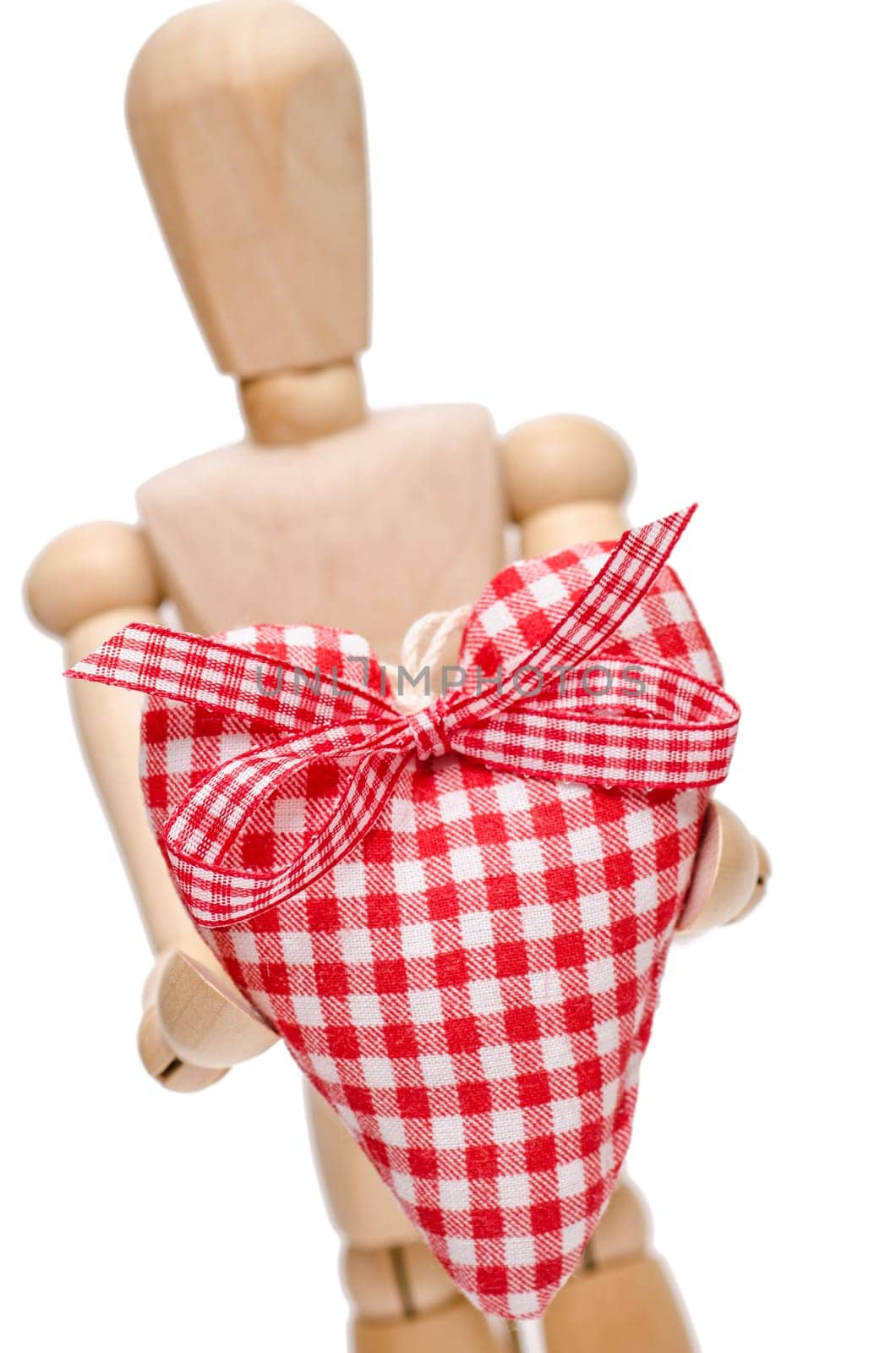 Detached male figure holds a red heart forward