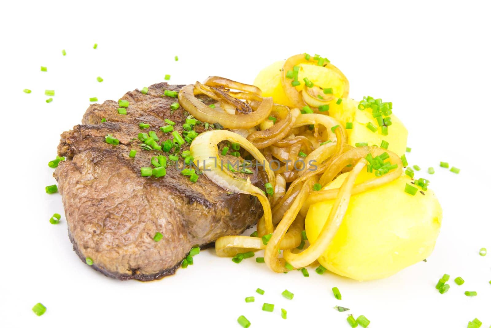 Juicy steak with potatoes and onions