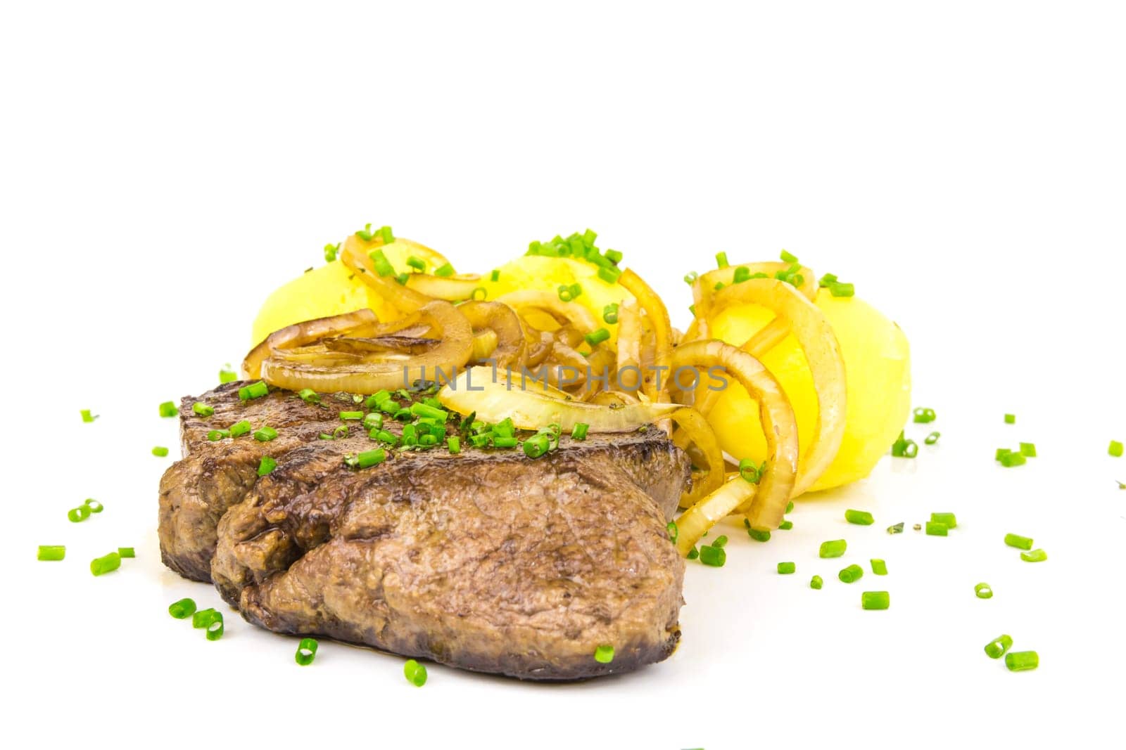 Juicy steak with potatoes and onions