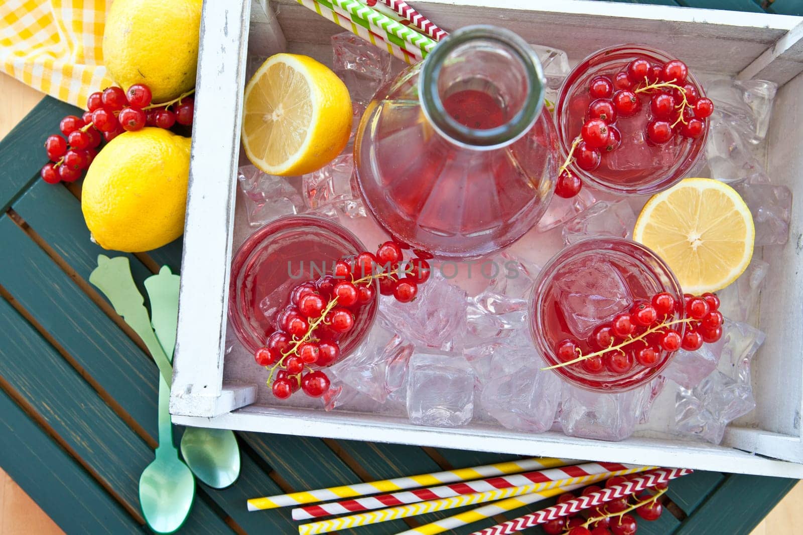 Homemade lemonade with currants and fresh lemons
