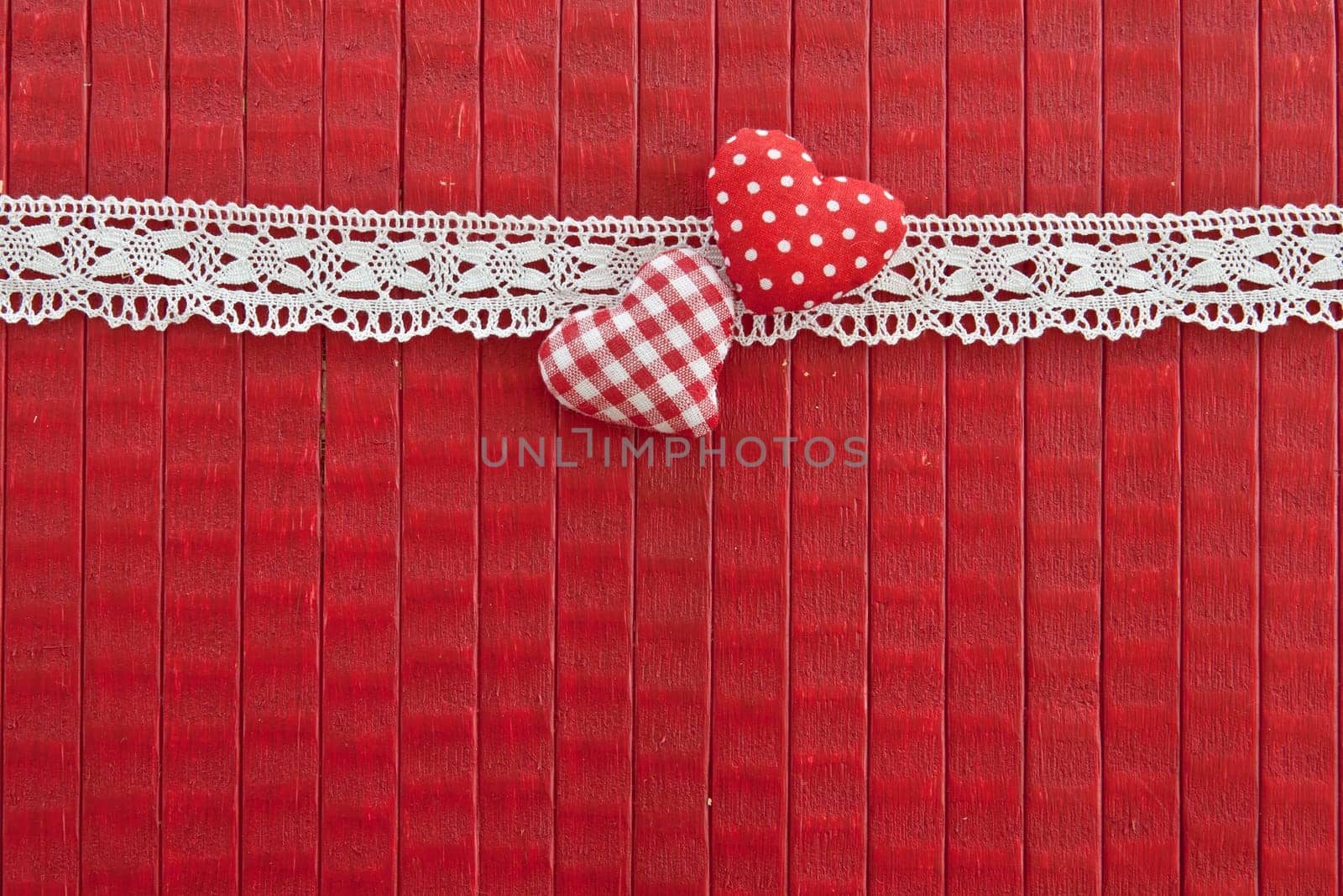 Red background with lace border and small red hearts