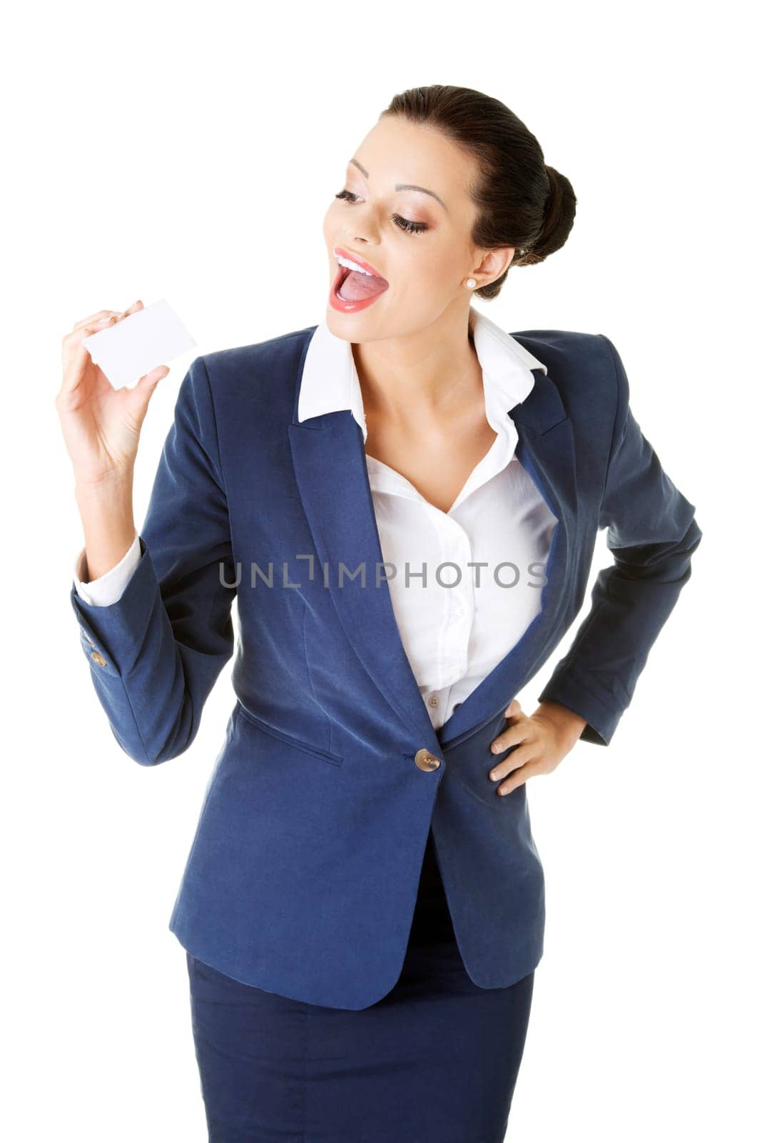Beautiful smiling businesswoman with businesscard. Isolated on white