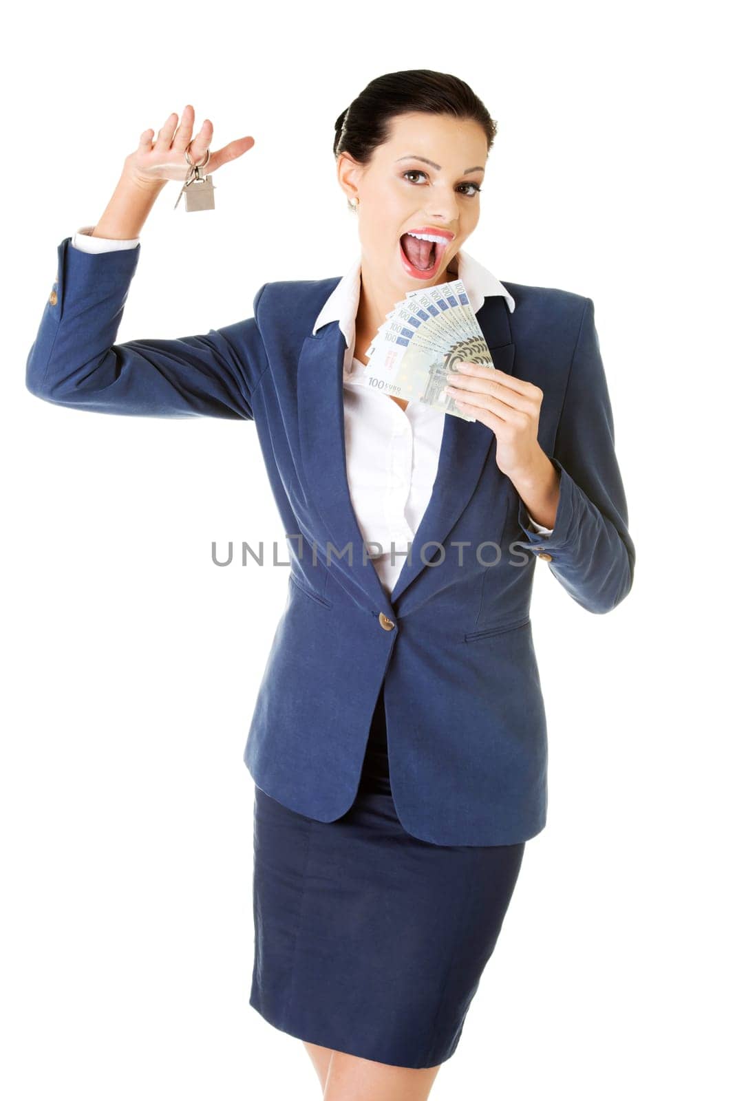 Beautiful young woman holding euro and house keys over white - real estate loan concept