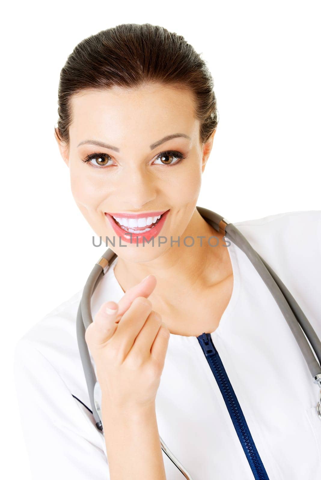 Female doctor pointing at the screen, isolated on white