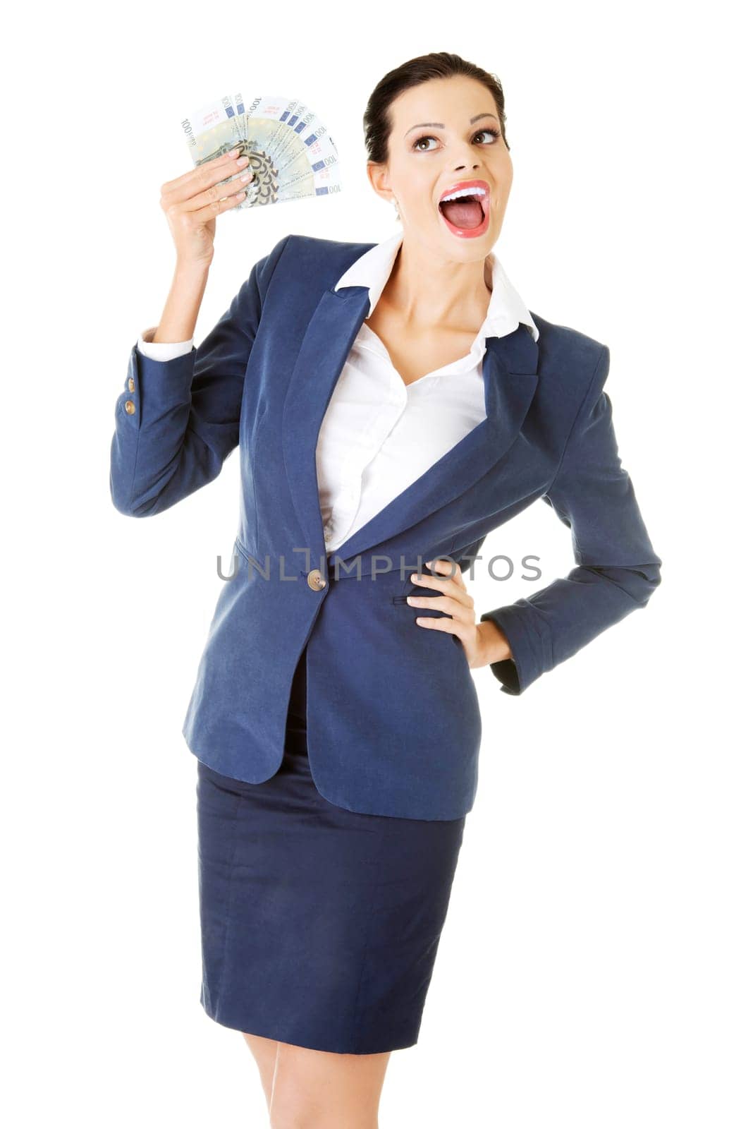 Happy attractive businesswoman holding euros