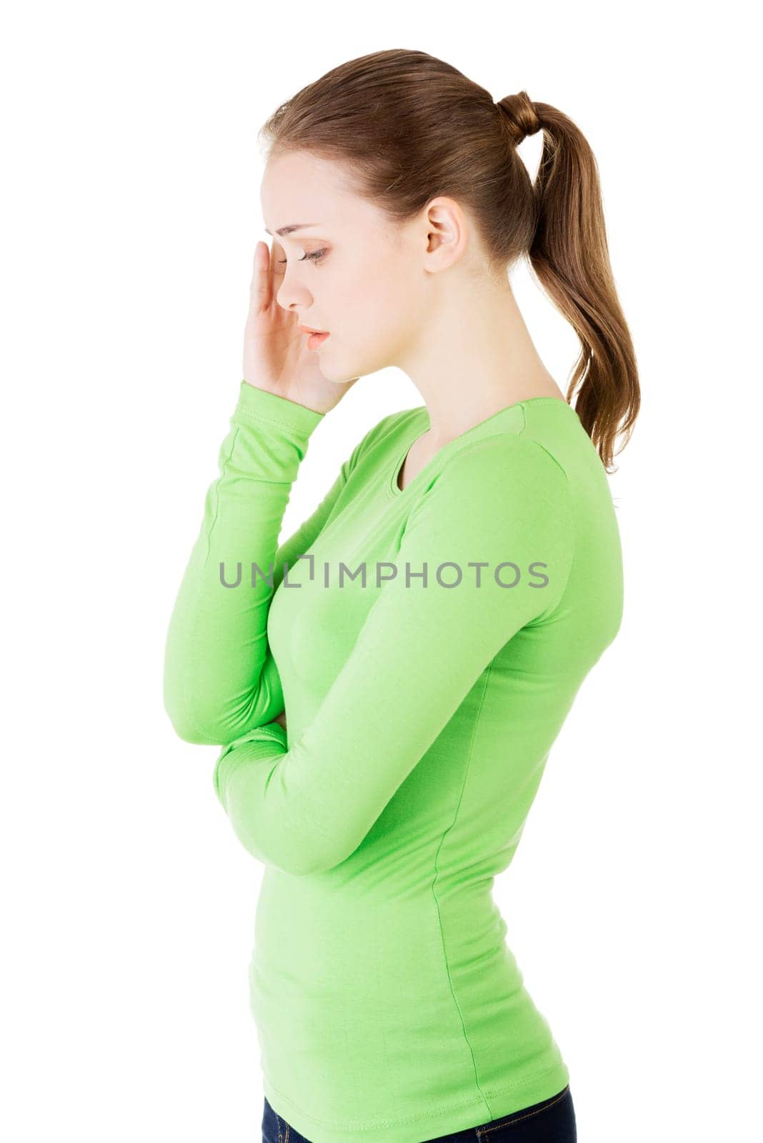 Young beautiful woman in depression, isolated on white