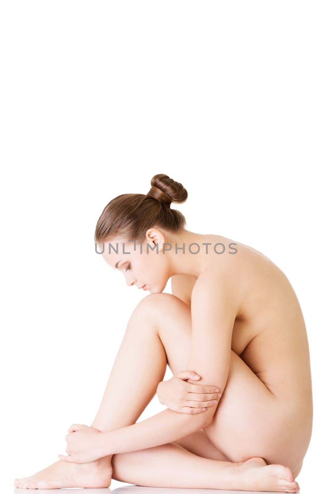 Sexy fit naked woman with healthy clean skin, isolated on white background