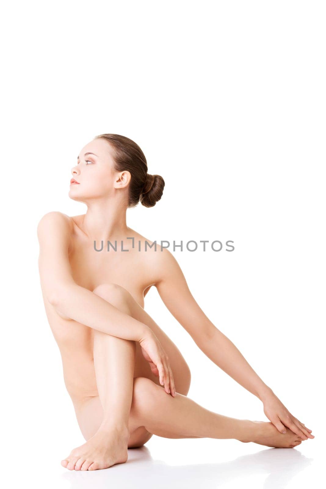 Sexy fit naked woman with healthy clean skin, isolated on white background