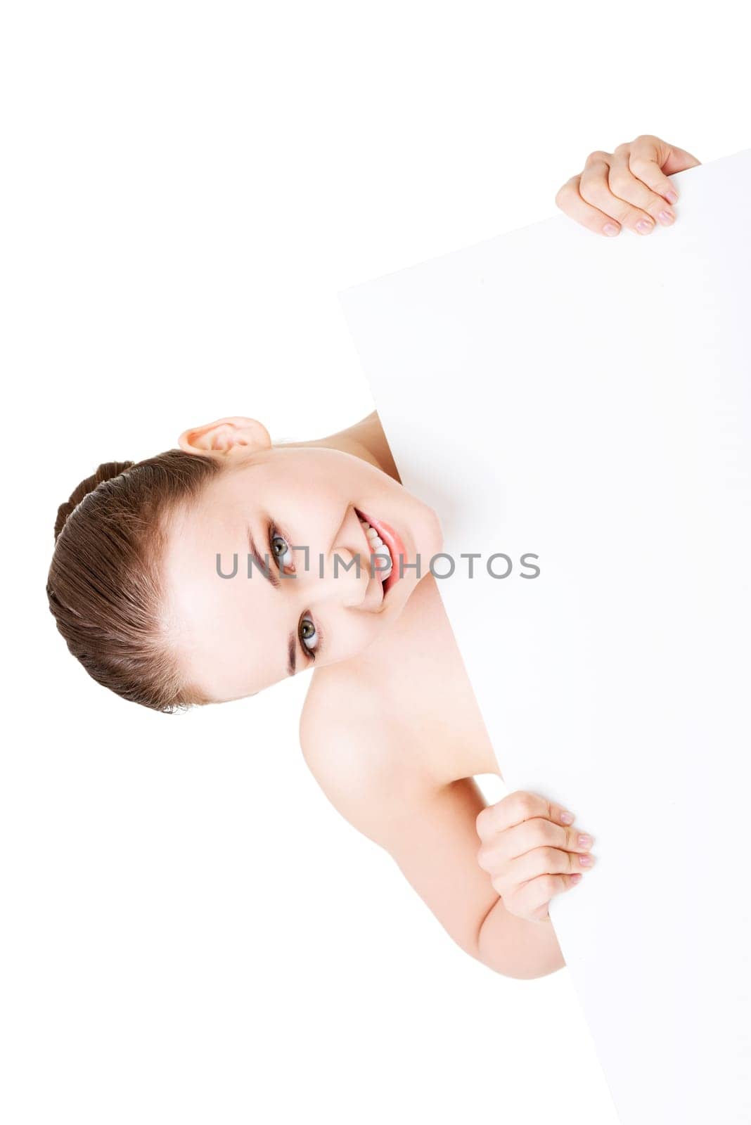 Beautiful woman with perfect skin and beautyful face holding blank board. Isolated on a White Background.