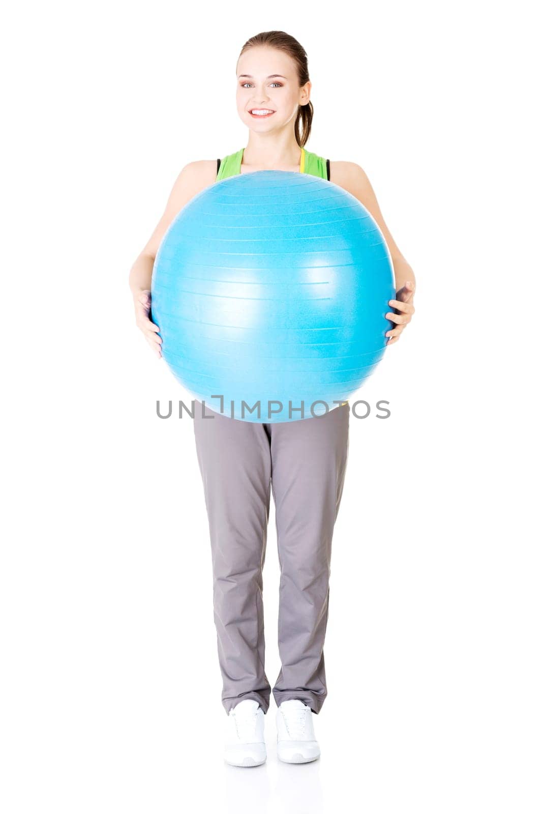 Beautiful young healthy lifestyle woman with pilates exercise ball.