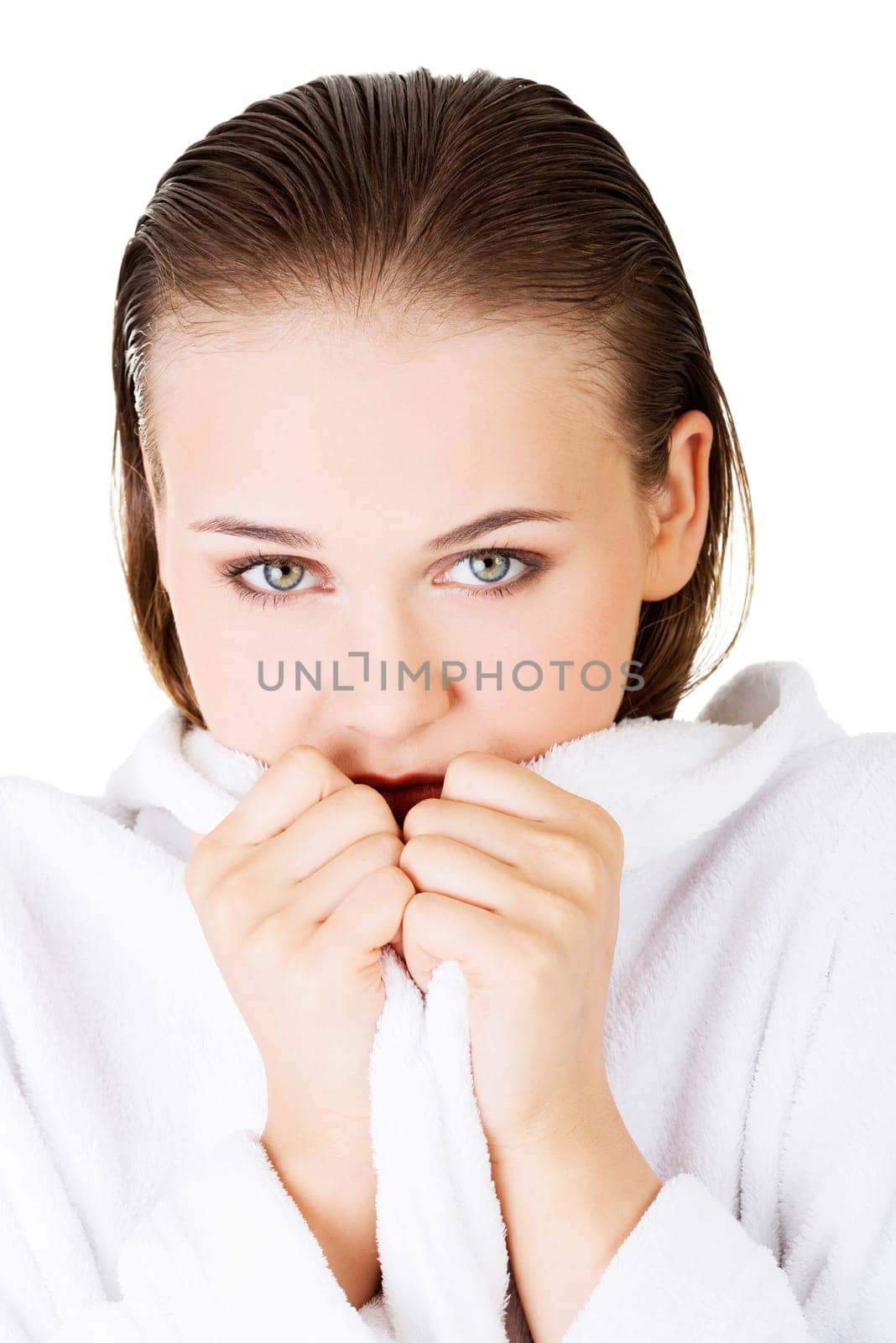 Attractive woman with a bathrobe, isolated on white