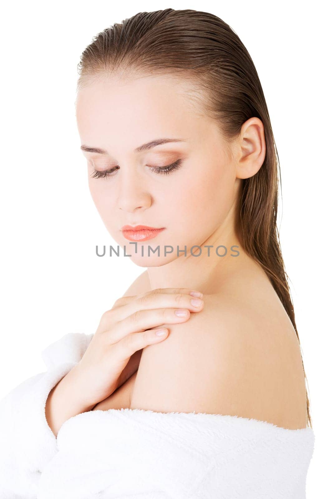 Attractive woman with a bathrobe, isolated on white