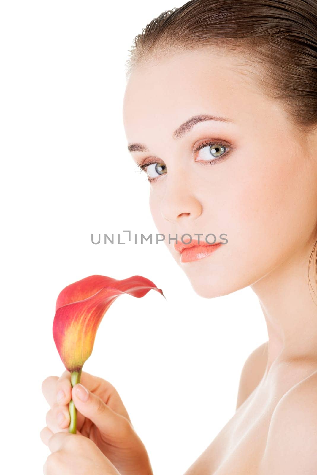 Beauty face of the young beautiful woman with flower. Girl on white background