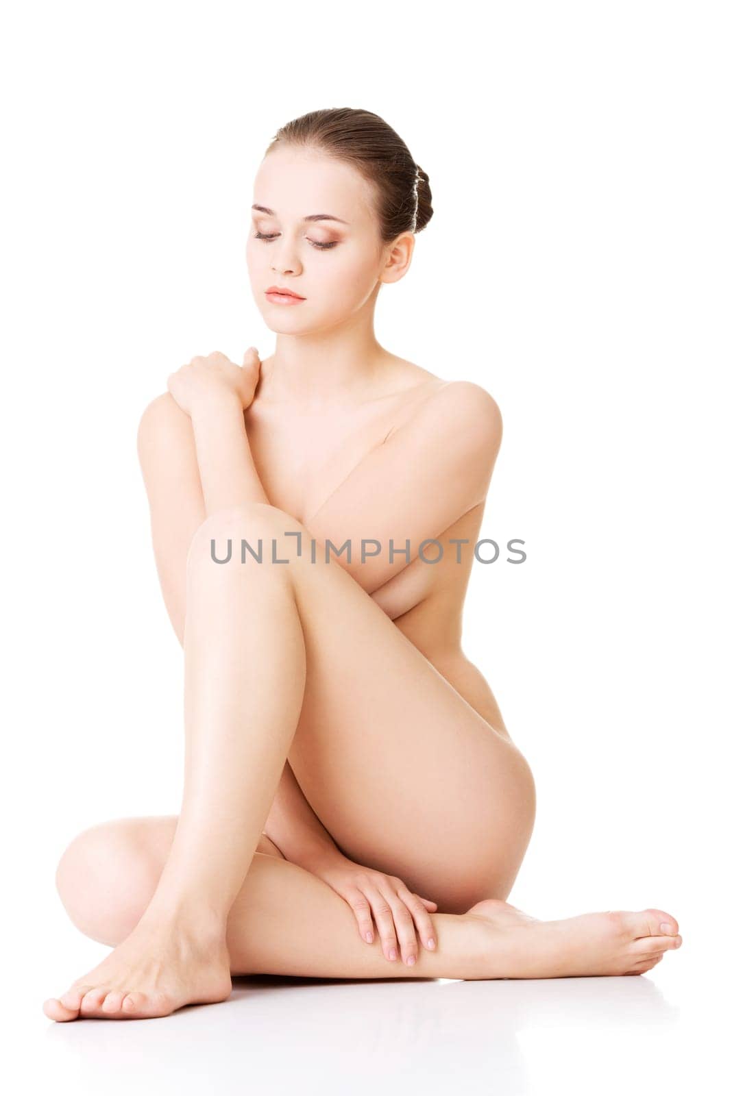 Sexy fit naked woman with healthy clean skin, isolated on white background