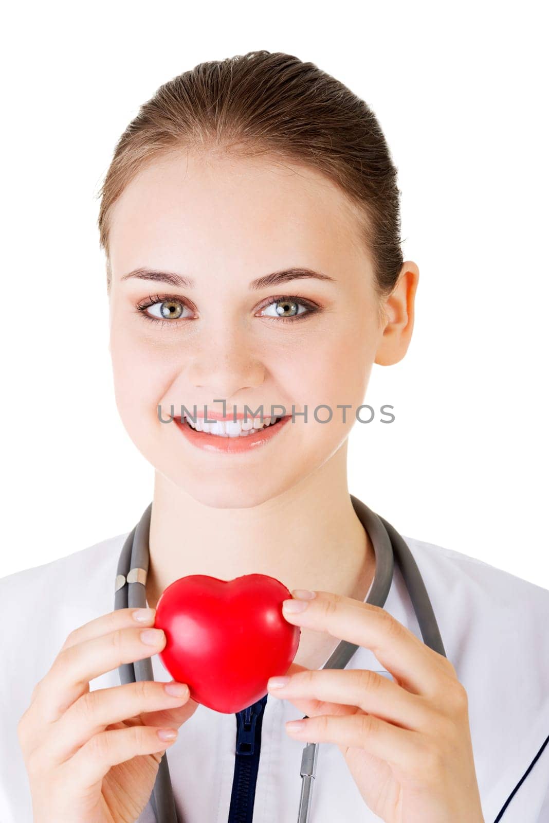 Female doctor holding red heart in hand. Isolated on white background