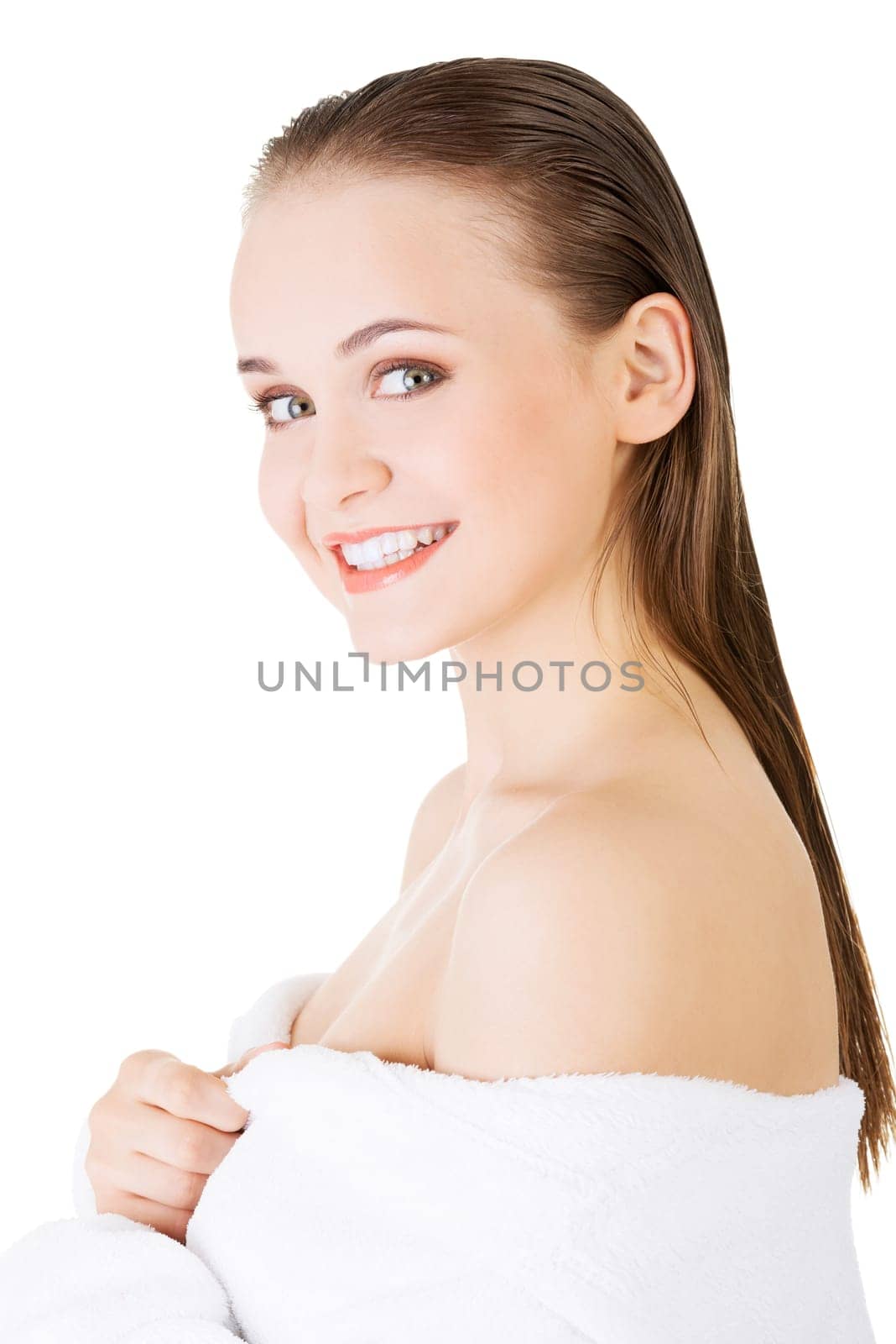 Attractive woman with a bathrobe, isolated on white