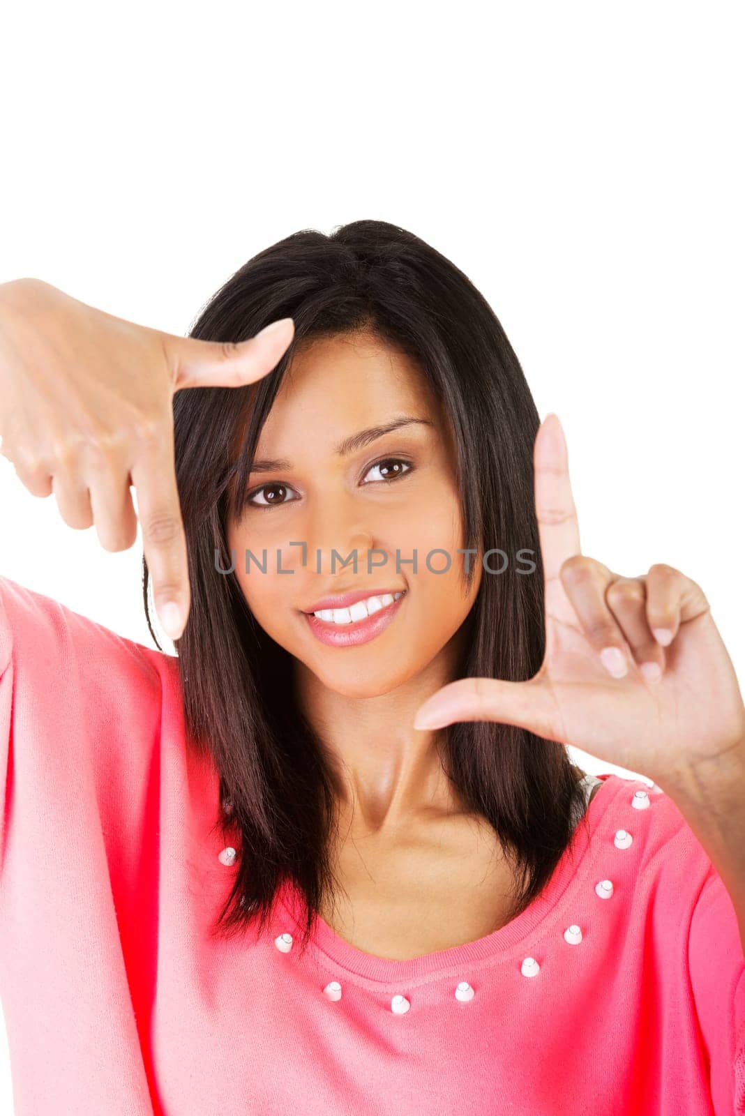 Smiling woman  is showing frame by hands. Happy girl with face in frame of palms. Isolated on white background.