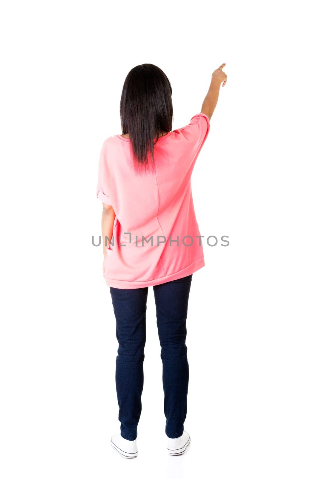 Happy , excited young woman pointing on copy space, isolated on white