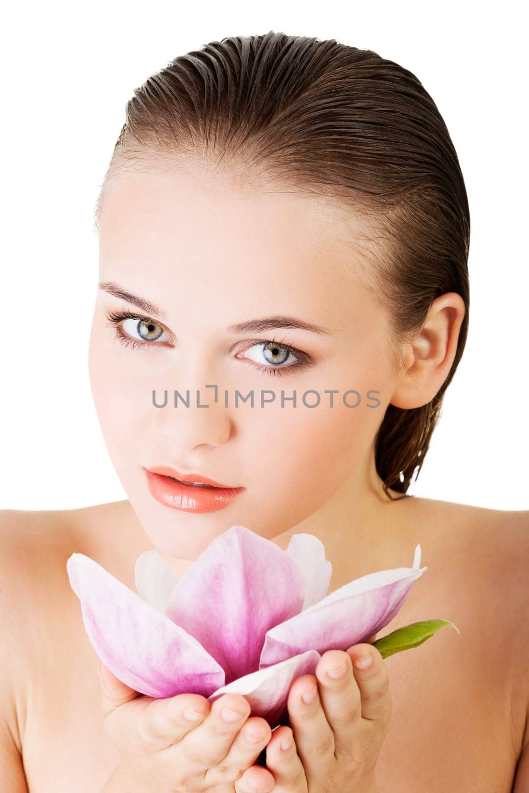 Beauty face of the young beautiful woman with flower. Girl on white background