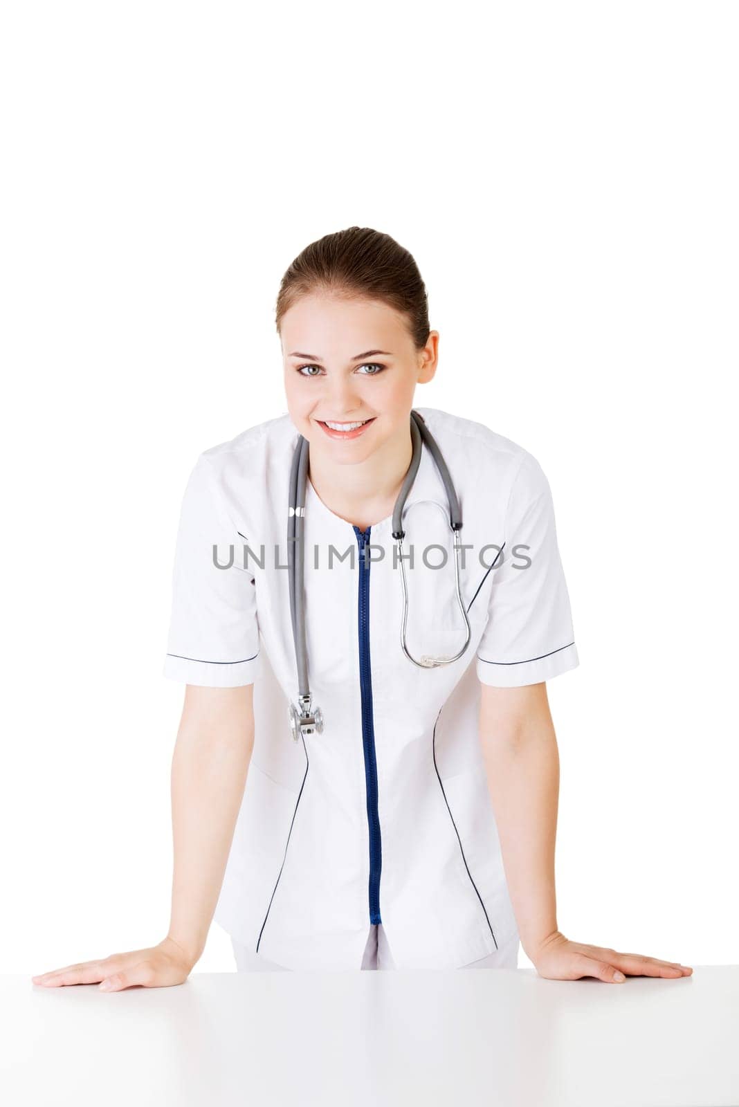 Medical doctor or nurse behind the desk. Isolated over white background