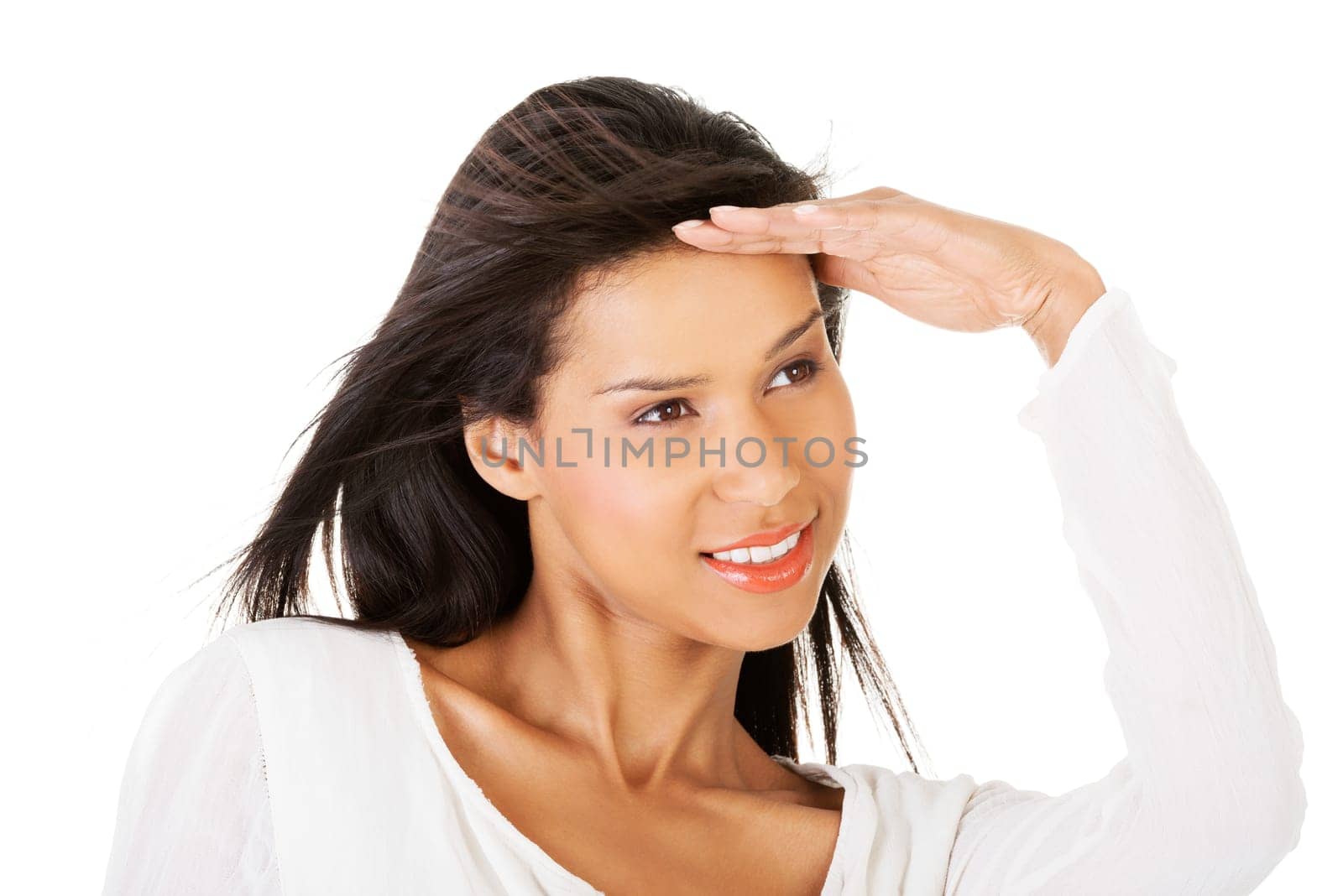 Attractive woman in summer clothes looking away. Isolated on white.