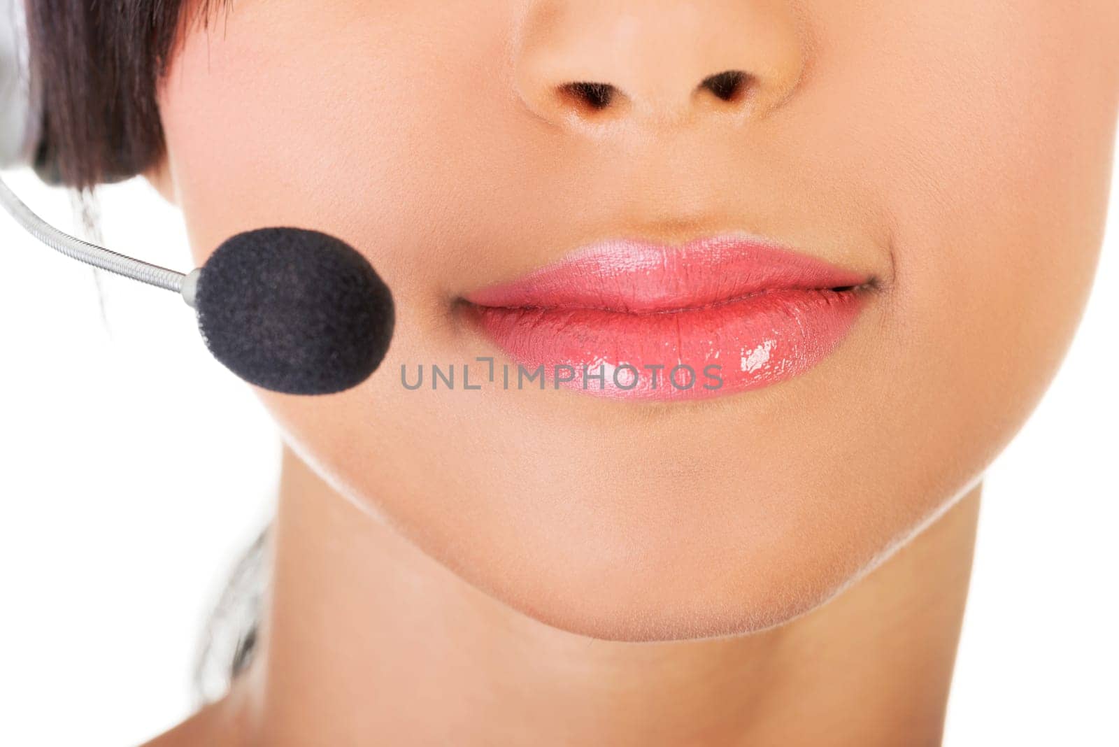 Beautiful young call-center assistant smiling , isolated