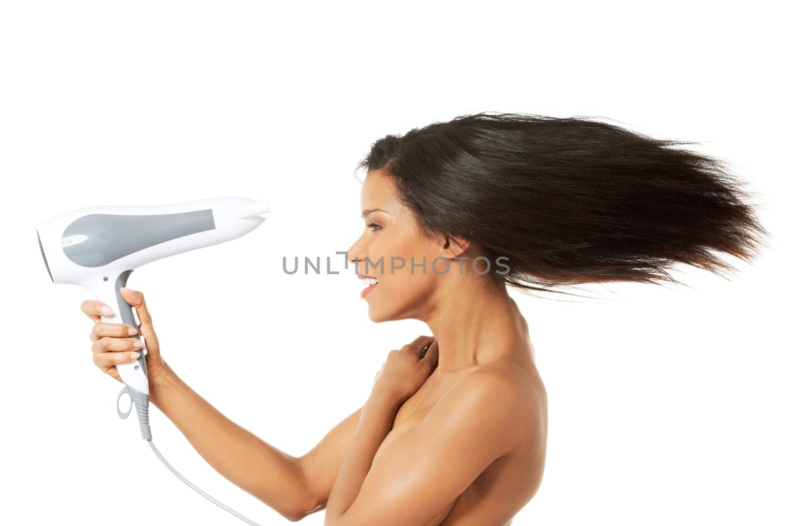 Woman with long hair holding strong blow dryer