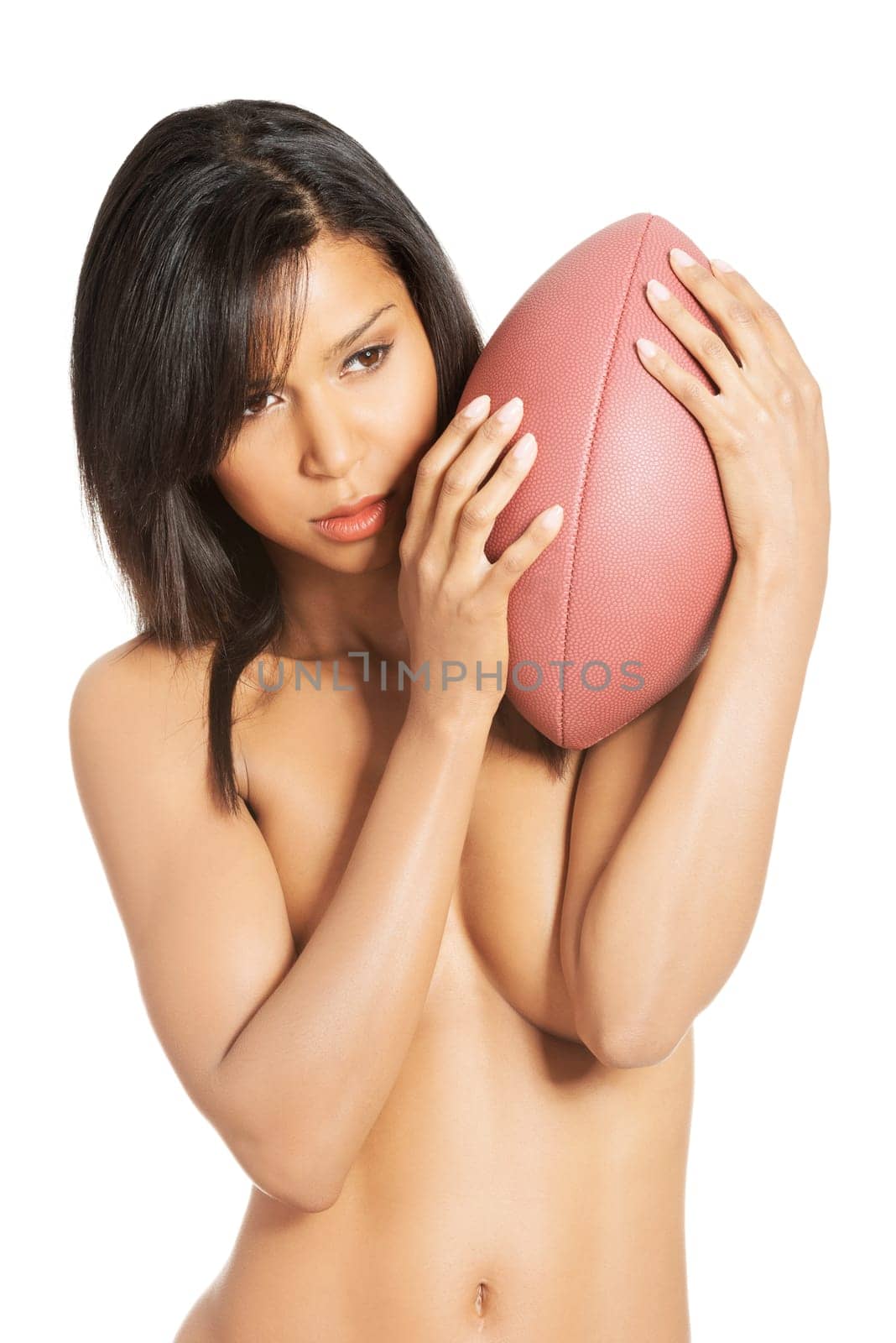Beautiful sexy woman with American football ball