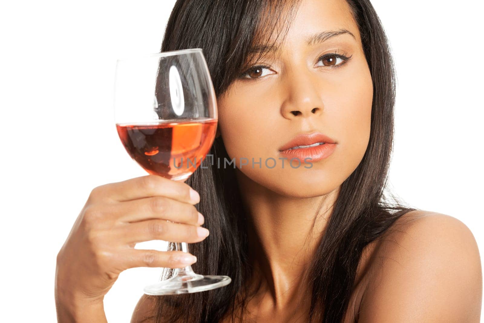 Portrait of young happy beautiful woman with glass of rose wine