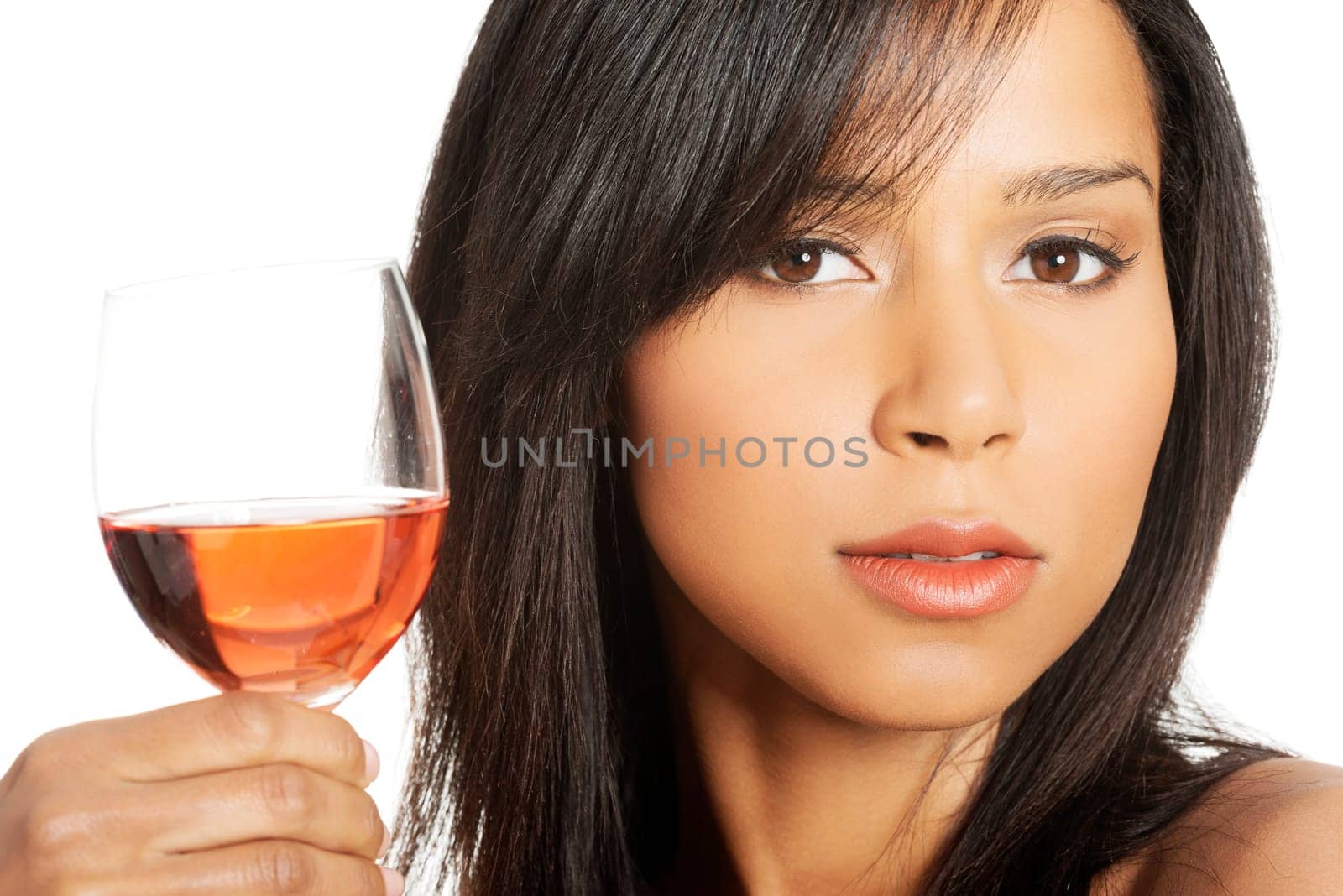 Portrait of young happy beautiful woman with glass of rose wine