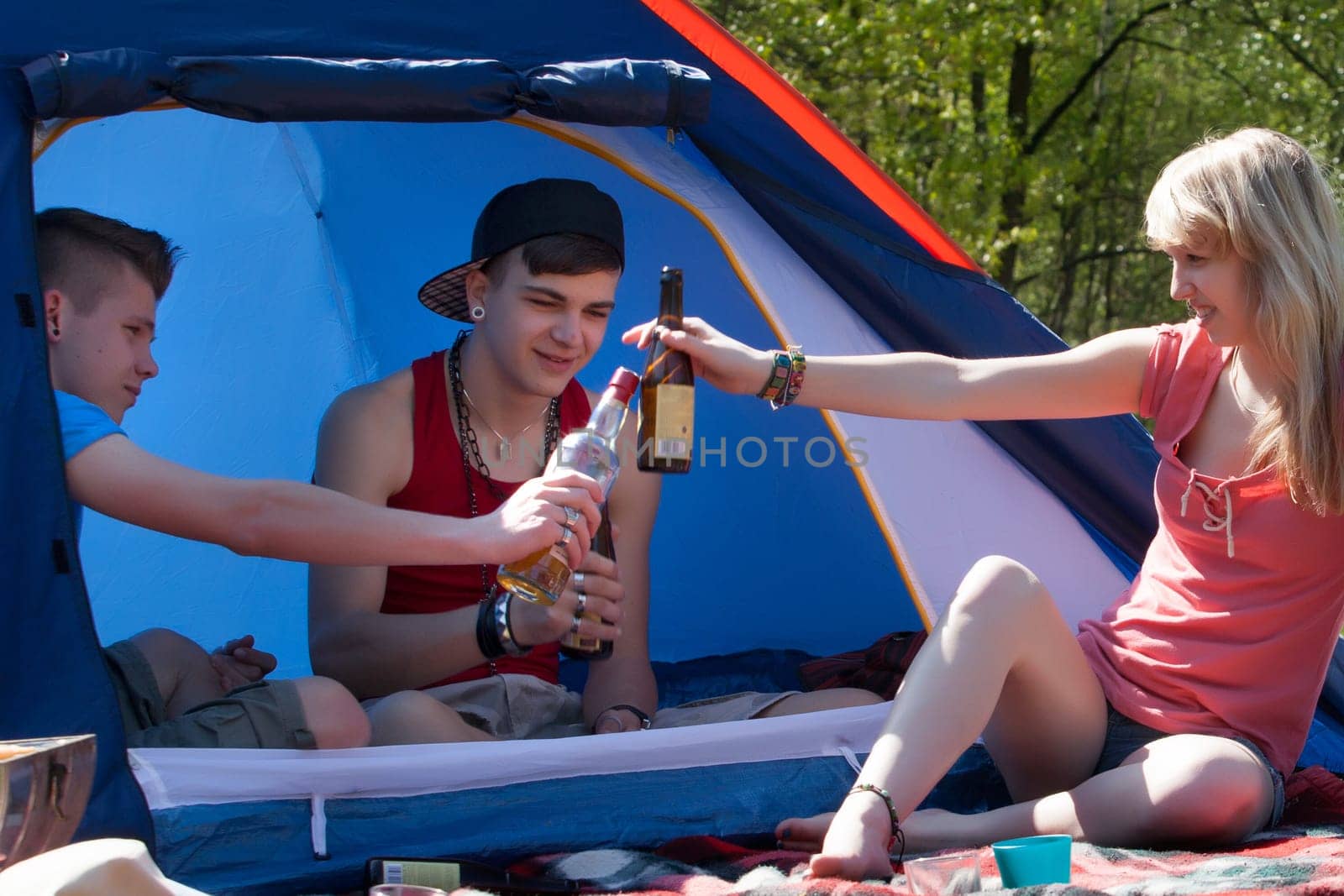 Young teenage group is having fun on a camping.