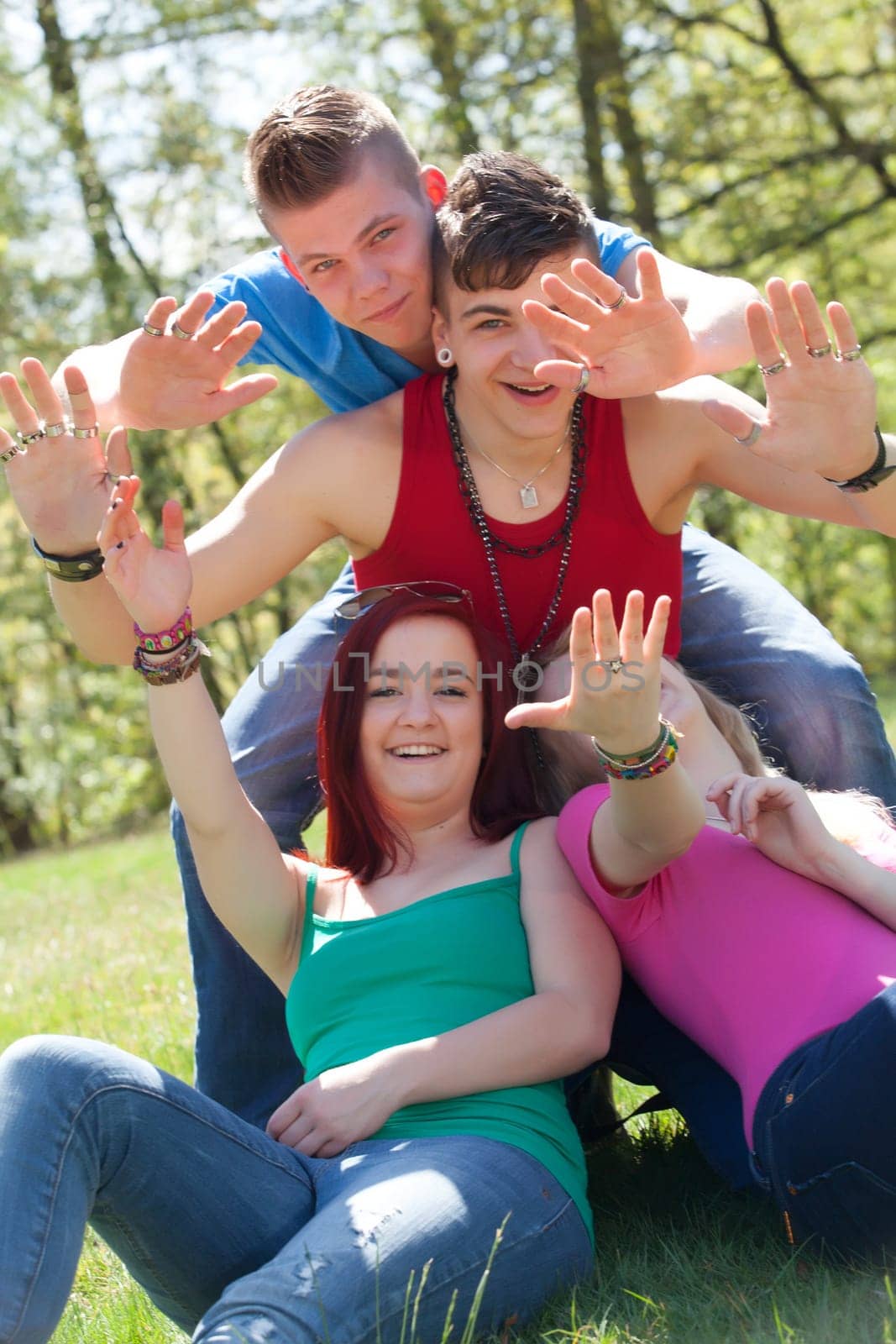 Young teenage group with colored shirts are having fun