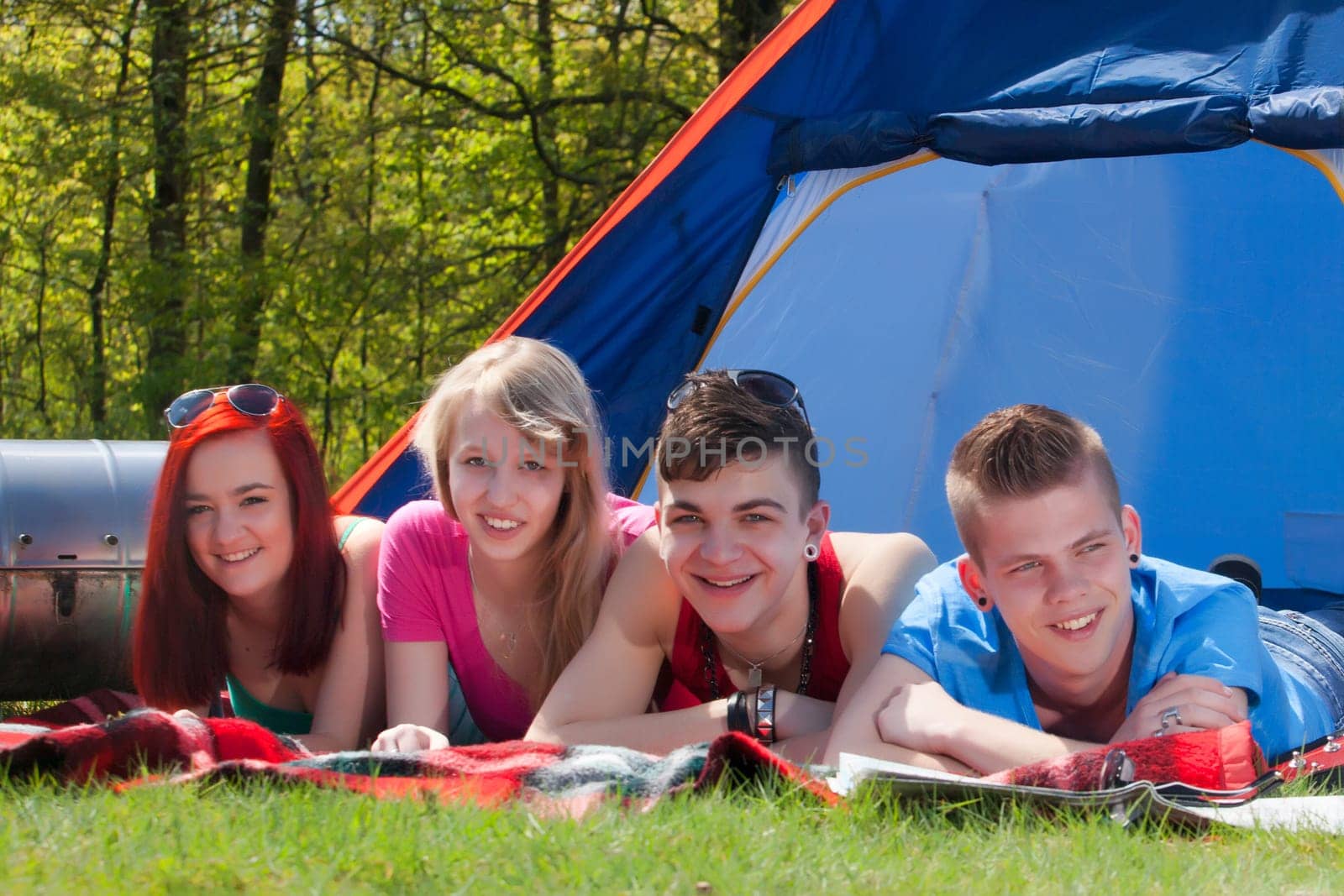Young teenager group are having their holliday on a camping