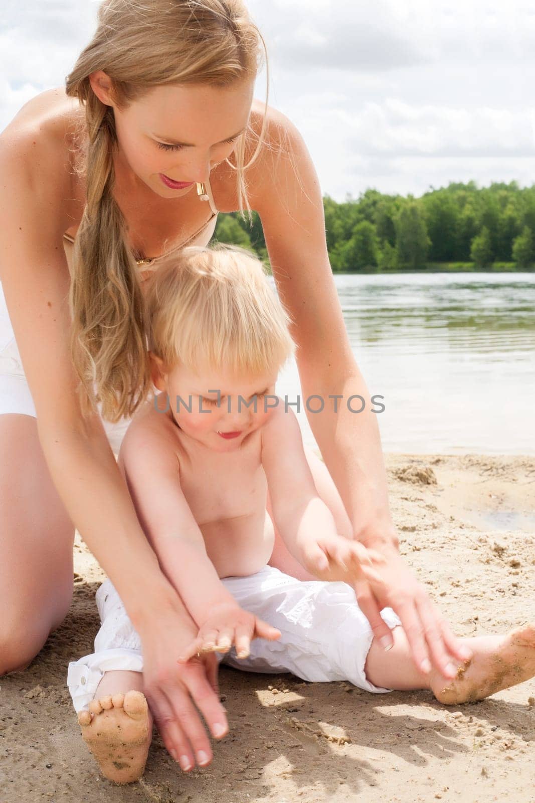 Happy mother and son having a nice day at the beach