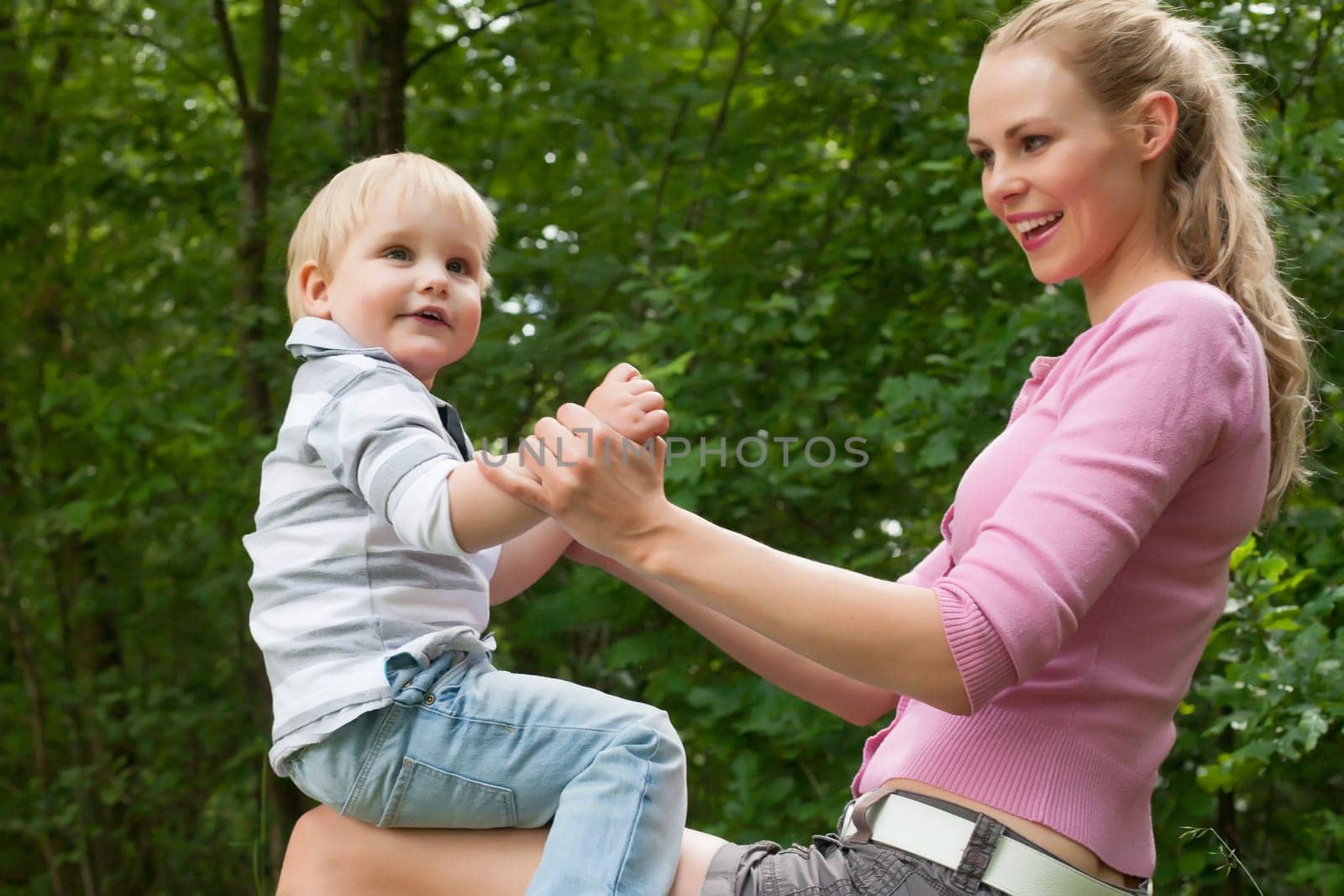 Happy mother and son having a nice day in the park