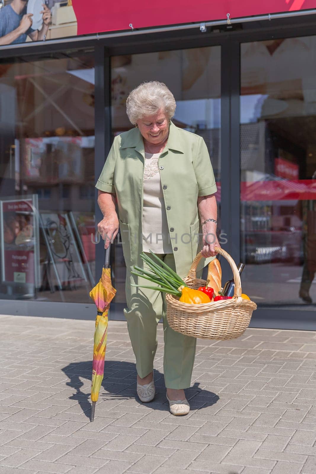 Elderly lady leaving a shopping mall