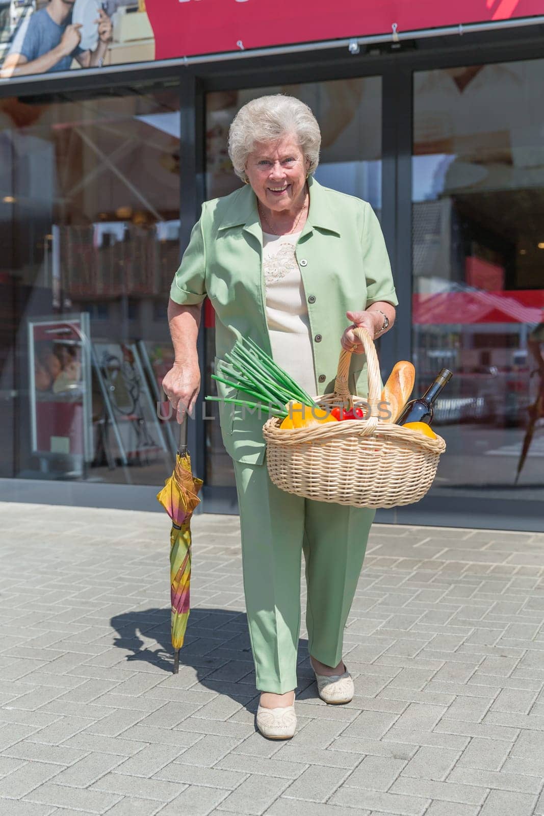 Elderly lady leaving a shopping mall