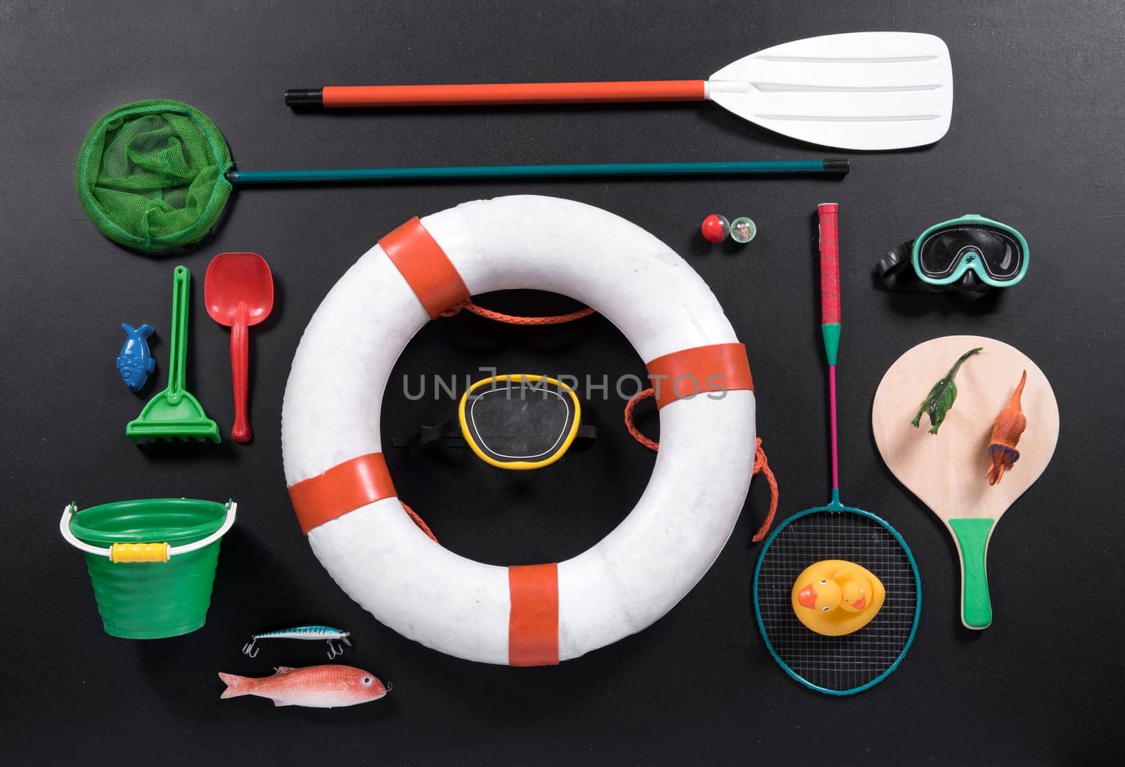 Different objects associated with the seaside surrounding life preserver ring, beach vacation concept