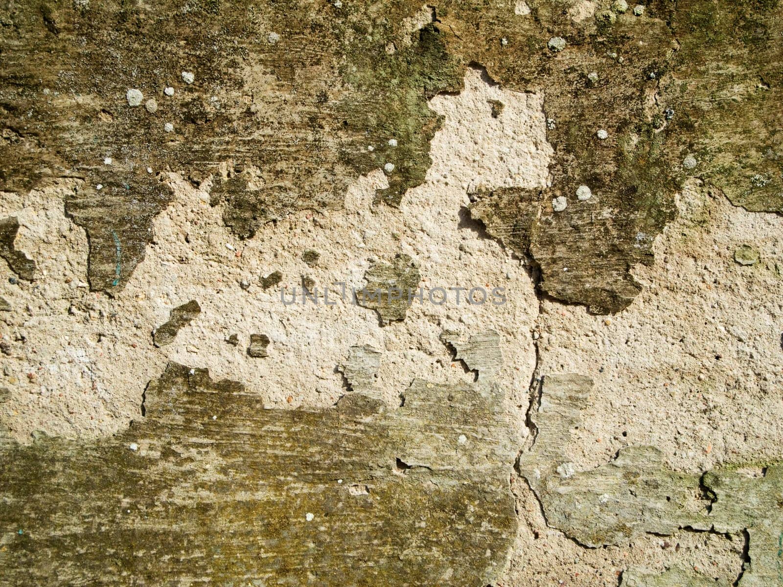 format-filling view of an old plastered and cracked wall with crumbling plaster