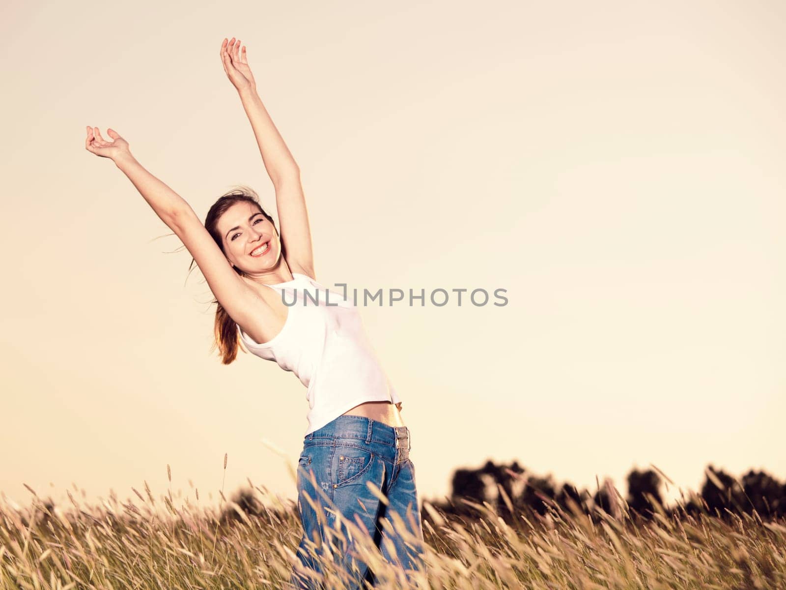 Outdoor portrait of a woman on a meadow releaxing