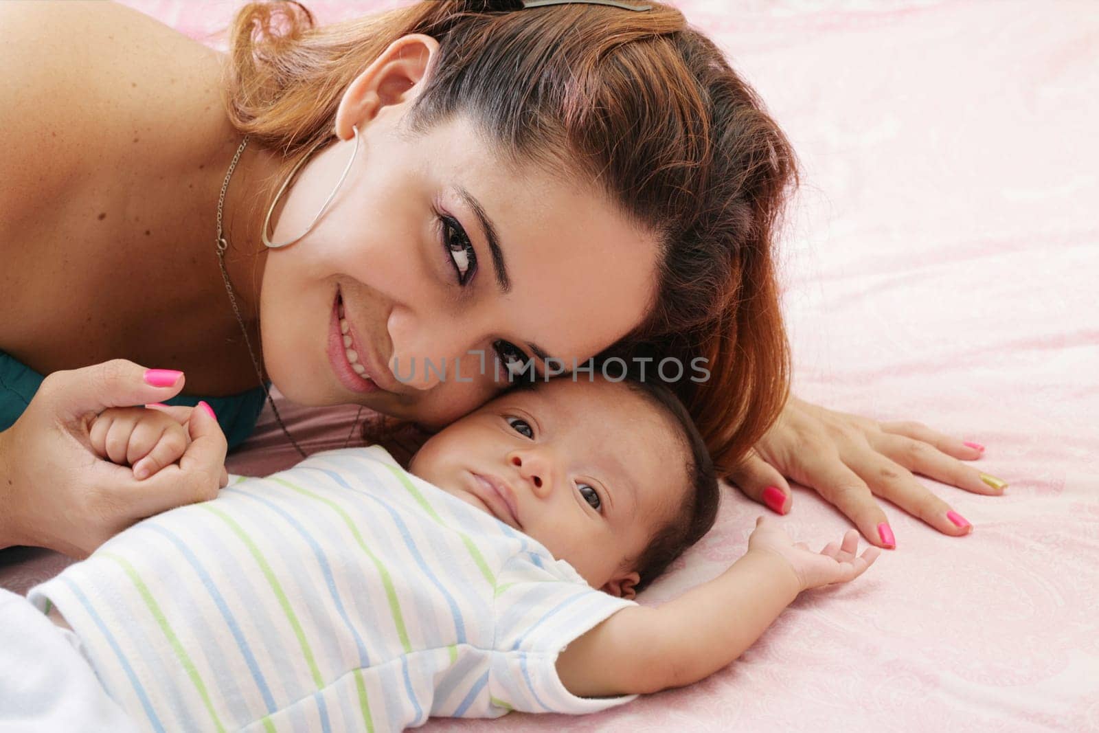 Portrait of happy woman with her baby