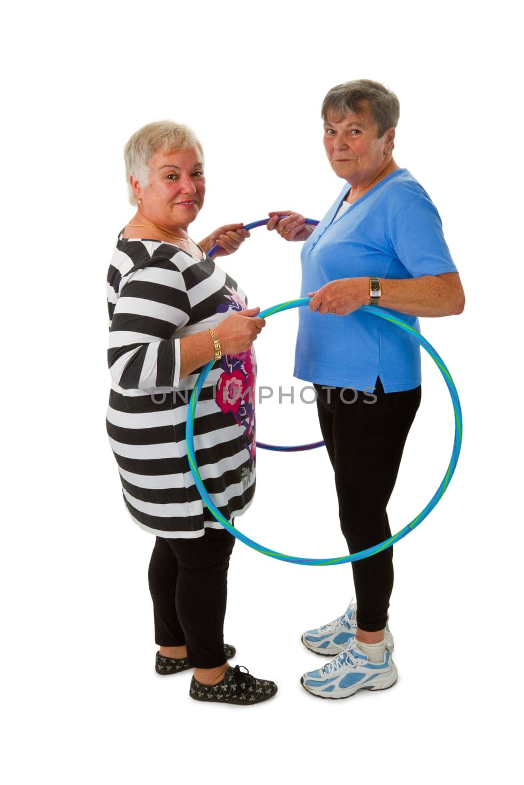 Two seniors with Hula Hoop - exposed on white background