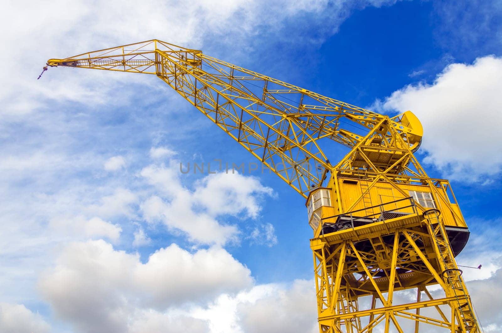 Old yellow crane and sky in Puerto Madero neighborhood of Buenos Aires, Argentina