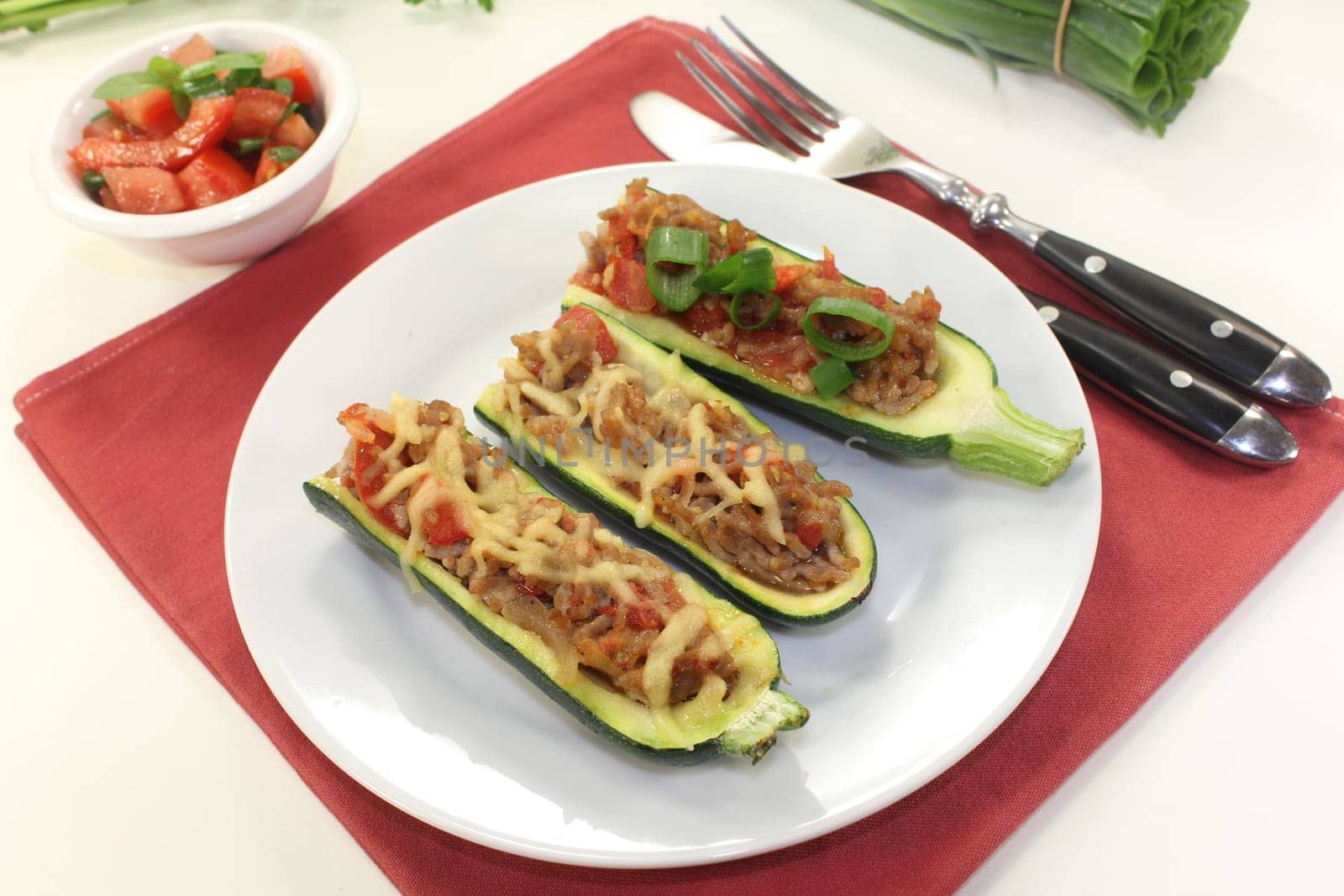 baked zucchinis stuffed with minced meat and tomatoes