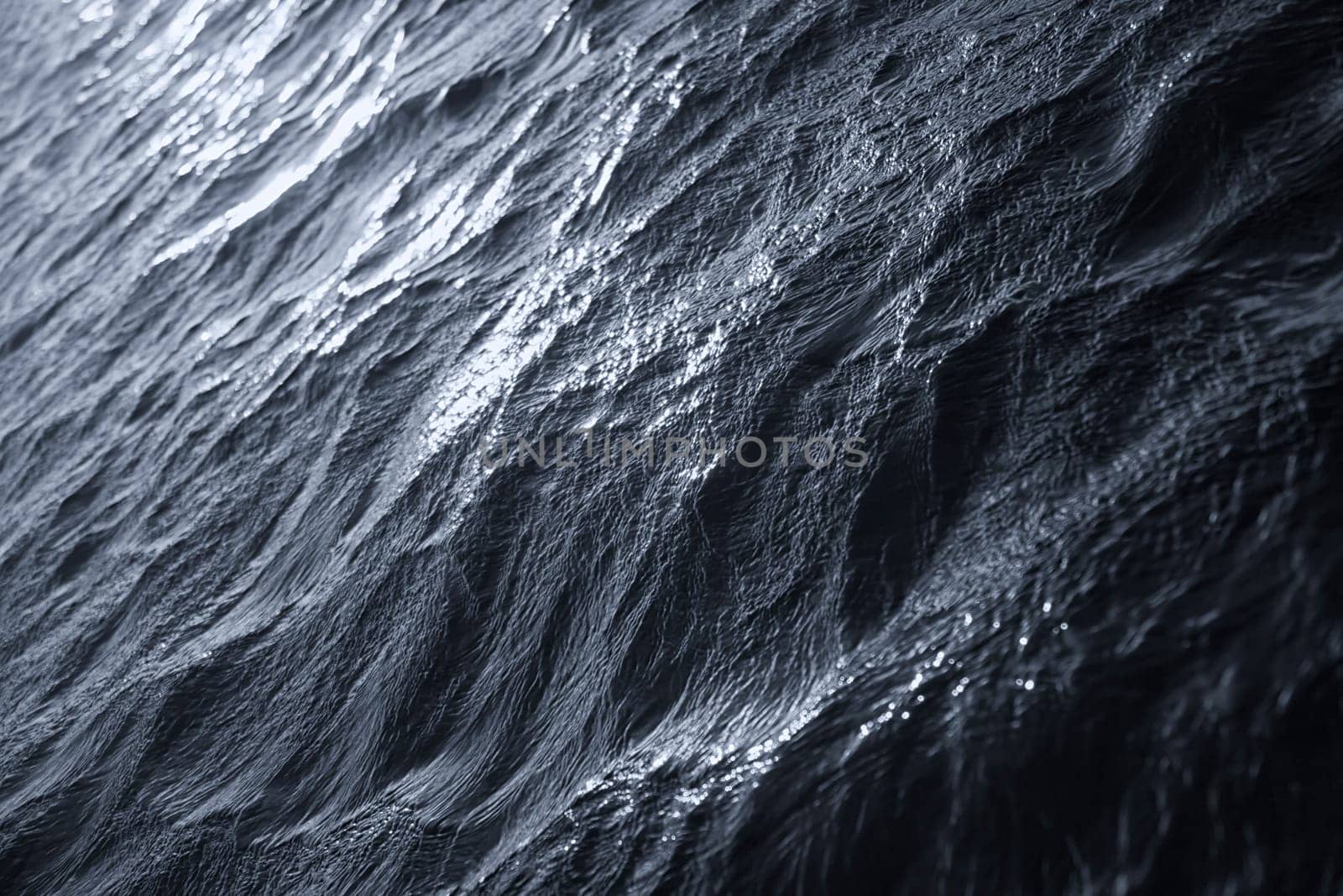 Closeup of dark abstract water waves.