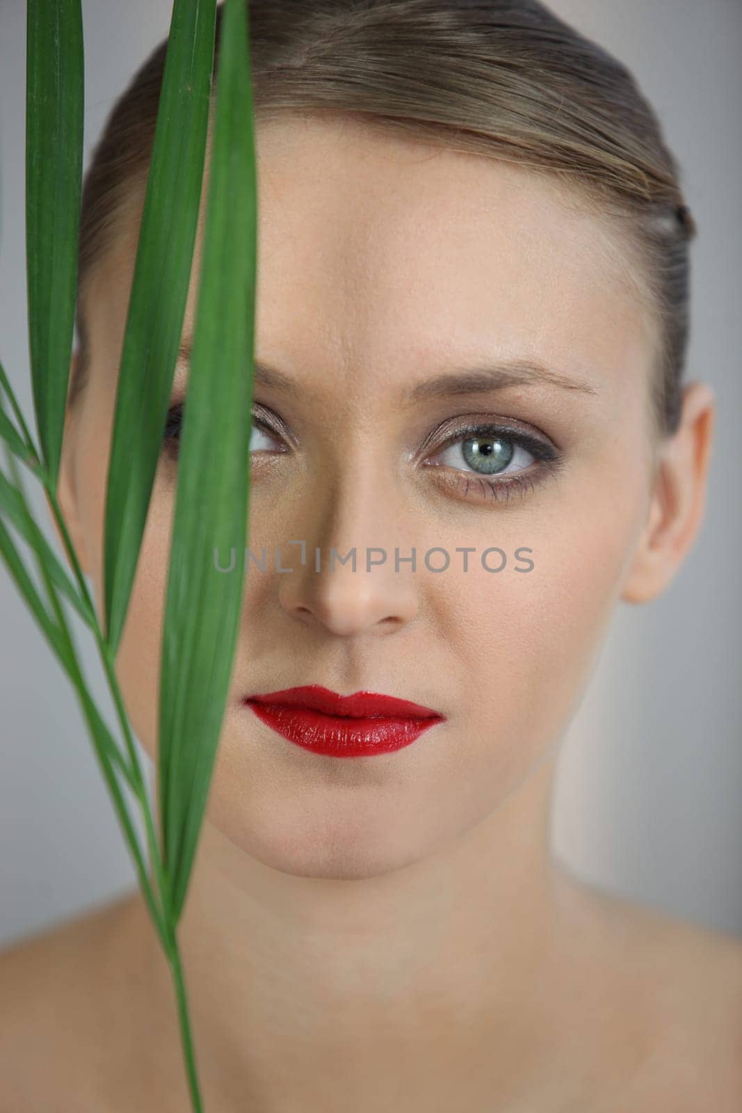 Portrait of woman with foliage