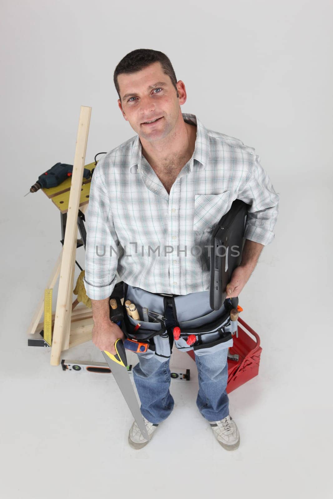 high angle shot of carpenter in studio