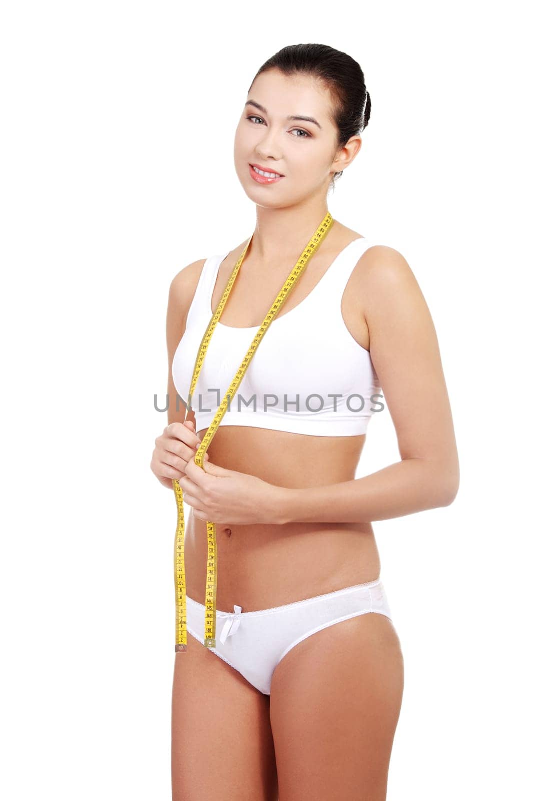 Pretty smiling woman with measurement type - isolated on white