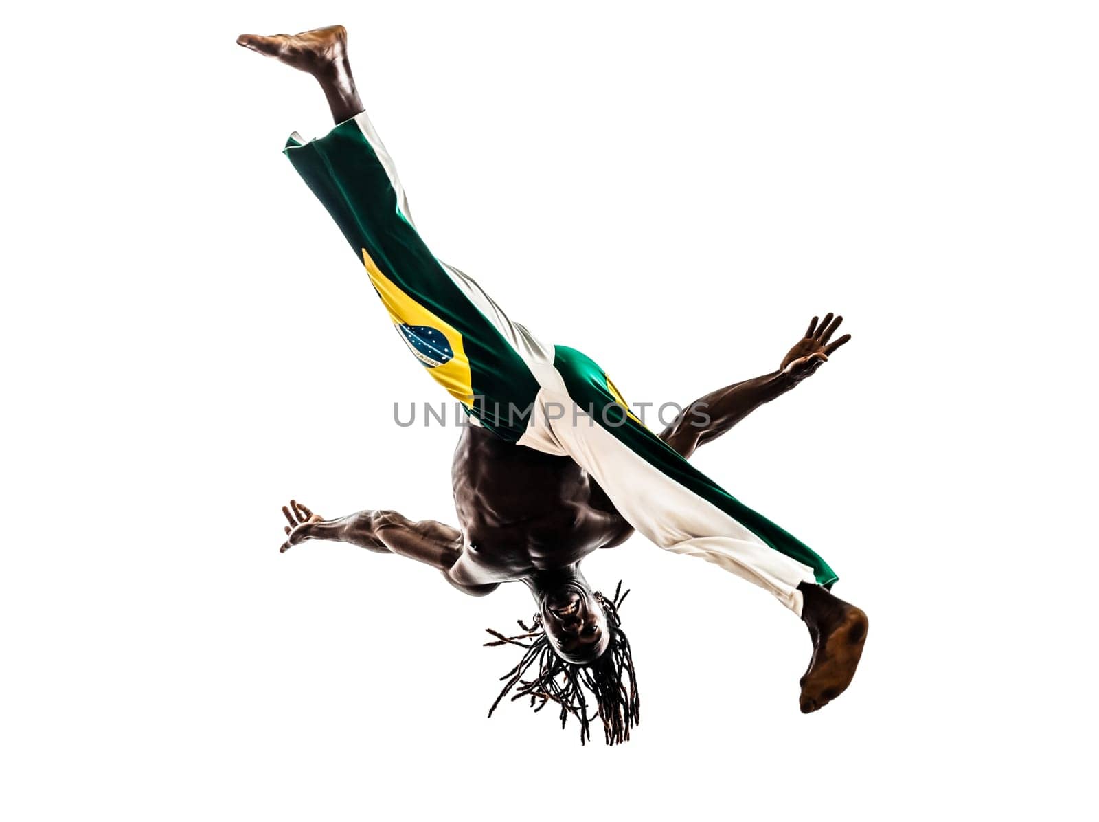 one brazilian  black man dancer dancing capoiera on white background